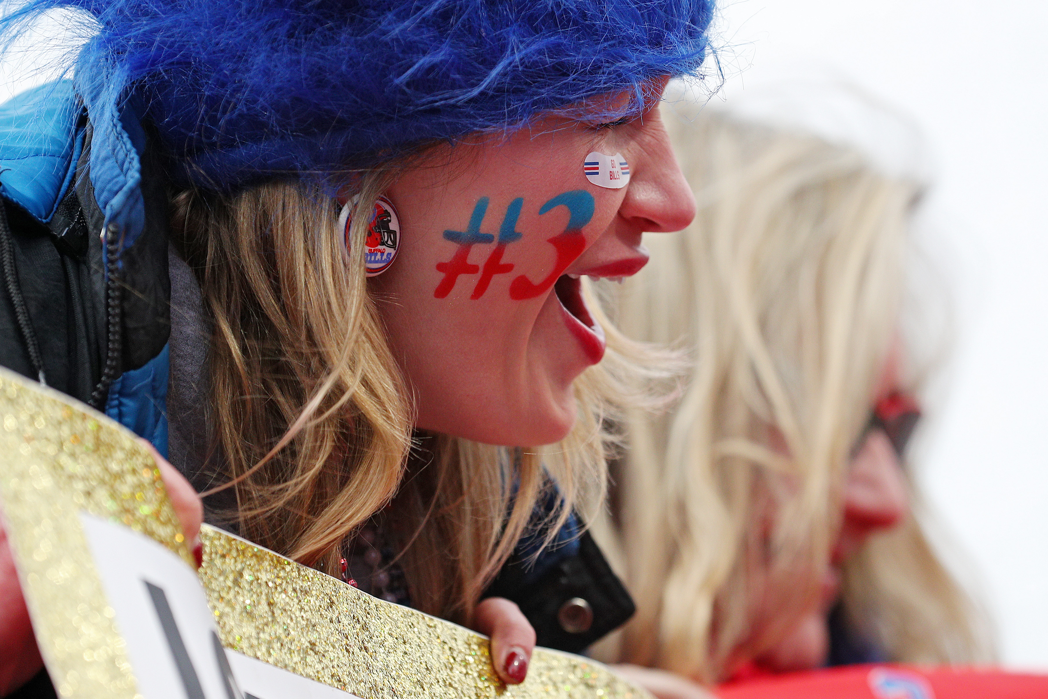 A woman has the number three painted on her face at the Buffalo Bills game on Sunday.