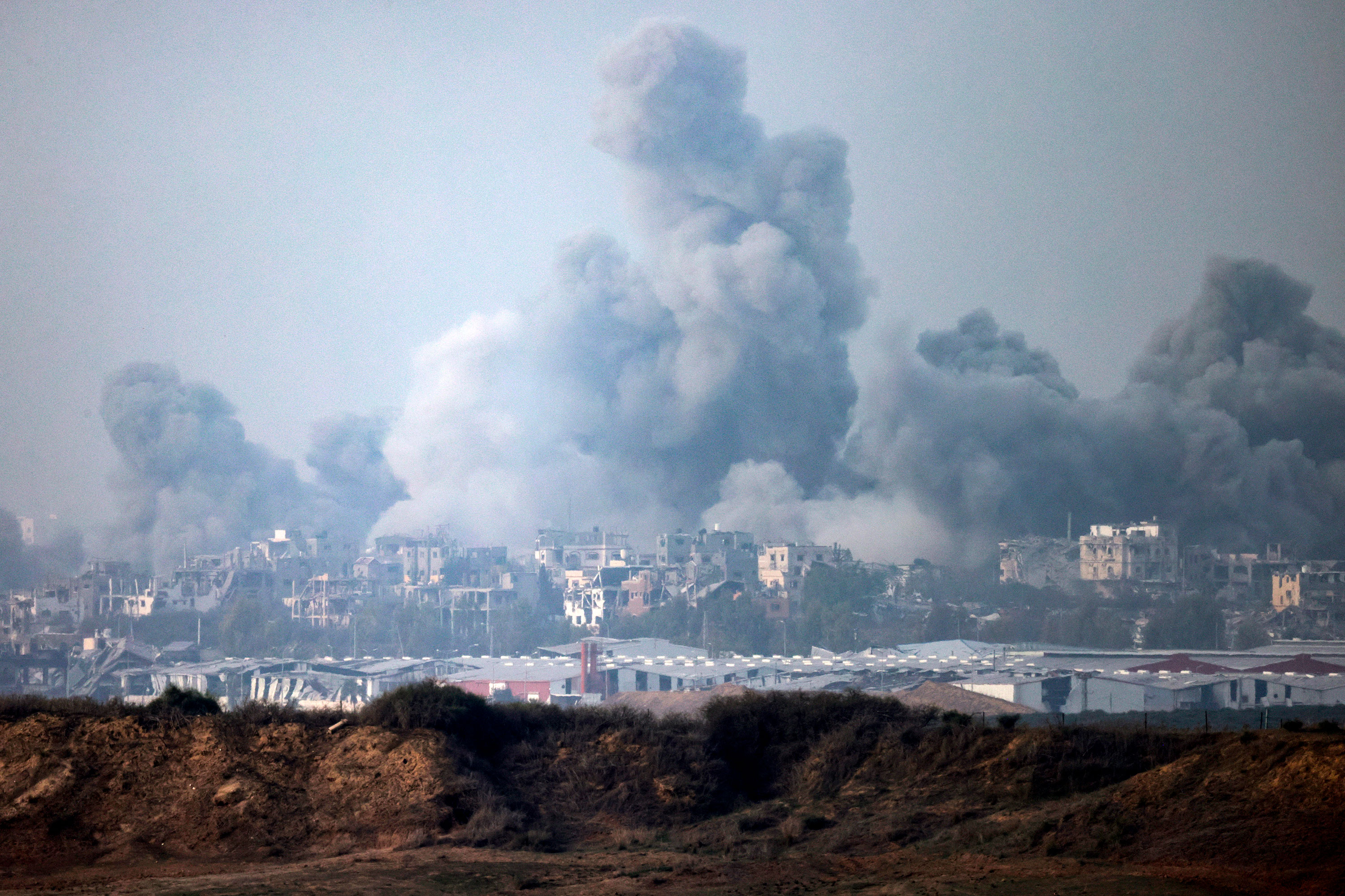 Smoke billows after Israeli airstrikes hit Gaza, as seen from southern Israel, on December 3. 