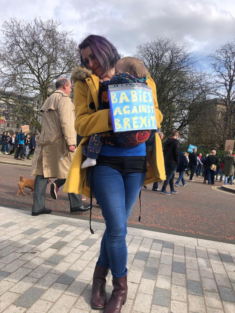 "Babies Against Brexit" reads the sign on 15-month-old Seren's back.