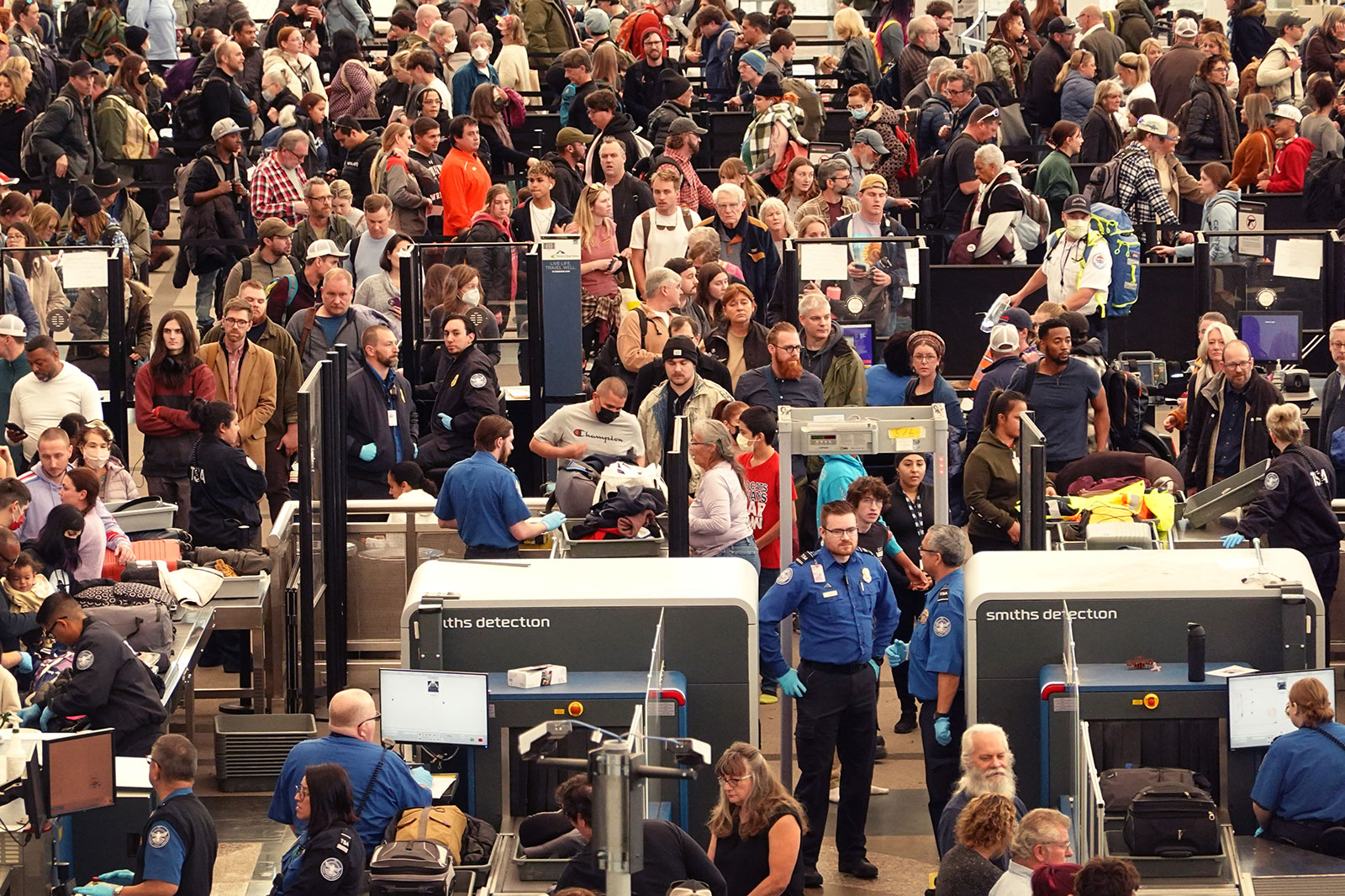 Travelers navigate a security checkpoint at Denver International Airport on November 22, in Denver, Colorado. 