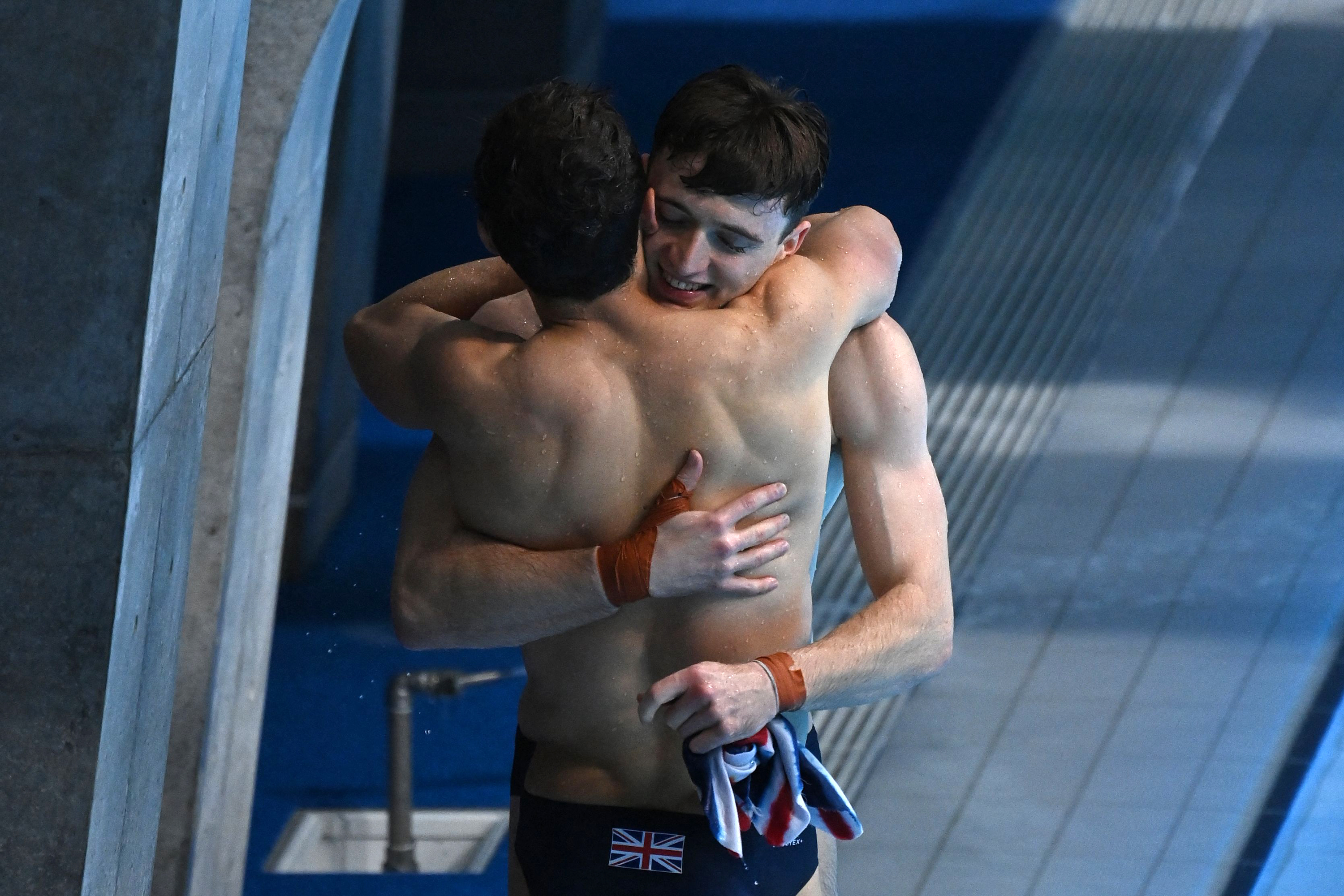 Britain's Tom Daley and Matty Lee hug after winning the synchronized 10m platform diving final on Monday, July 26. 