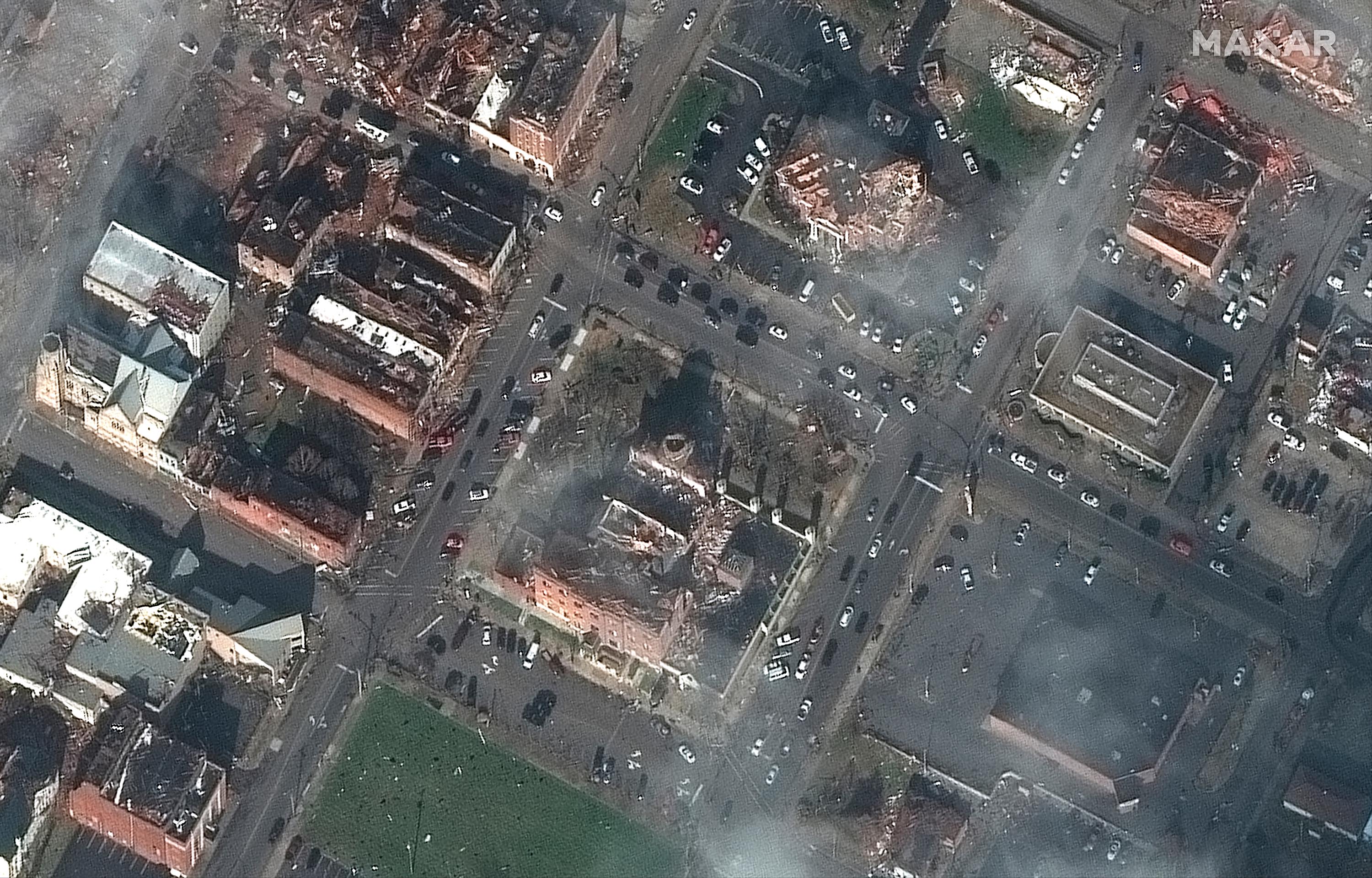 This Saturday, December 11 satellite photo provided by Maxar shows the county courthouse and other nearby buildings after a tornado caused heavy damage in the area, in Mayfield, Kentucky.