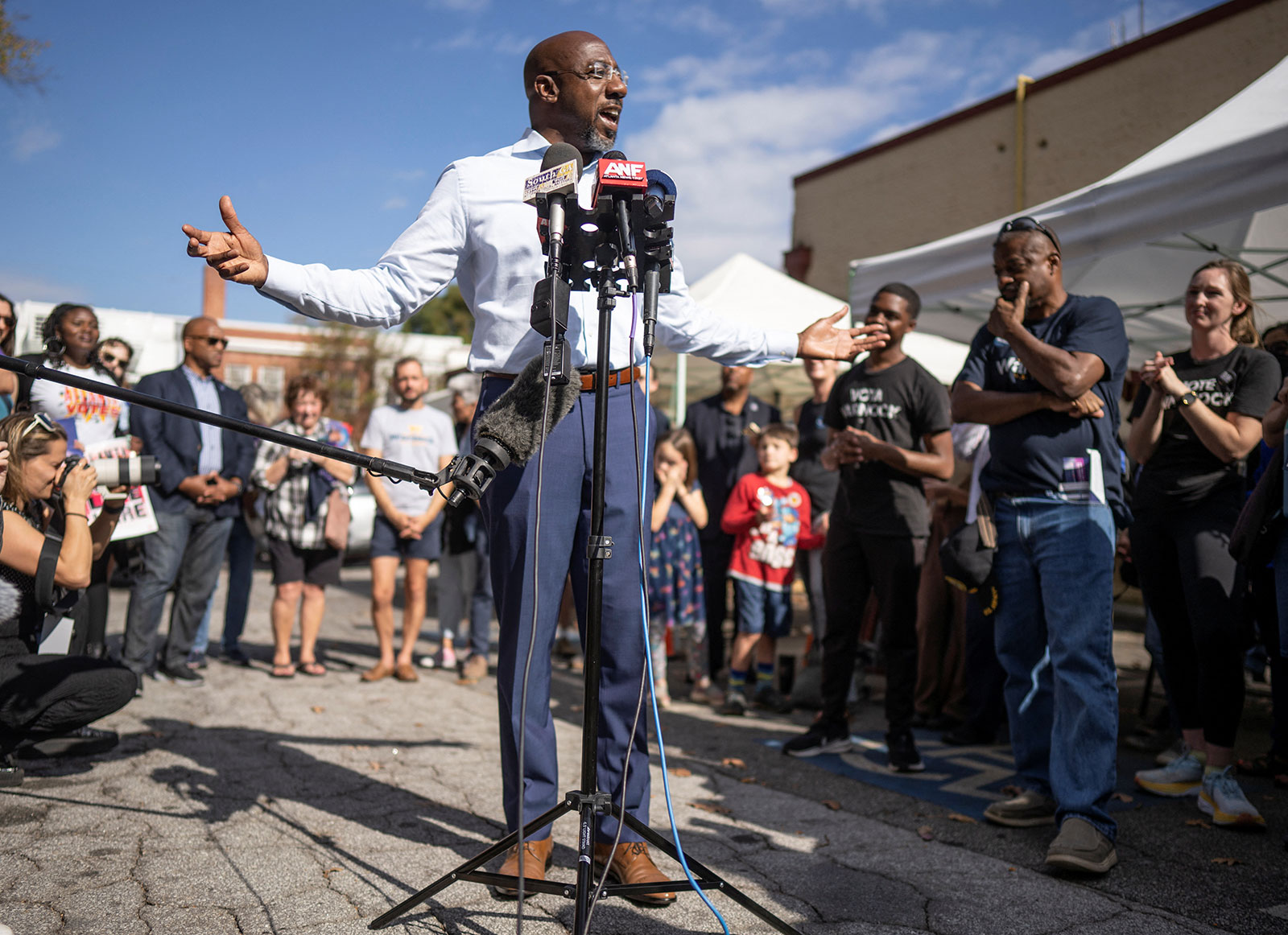 Raphael Warnock speaks to supporters during a campaign event in Atlanta on Tuesday. 