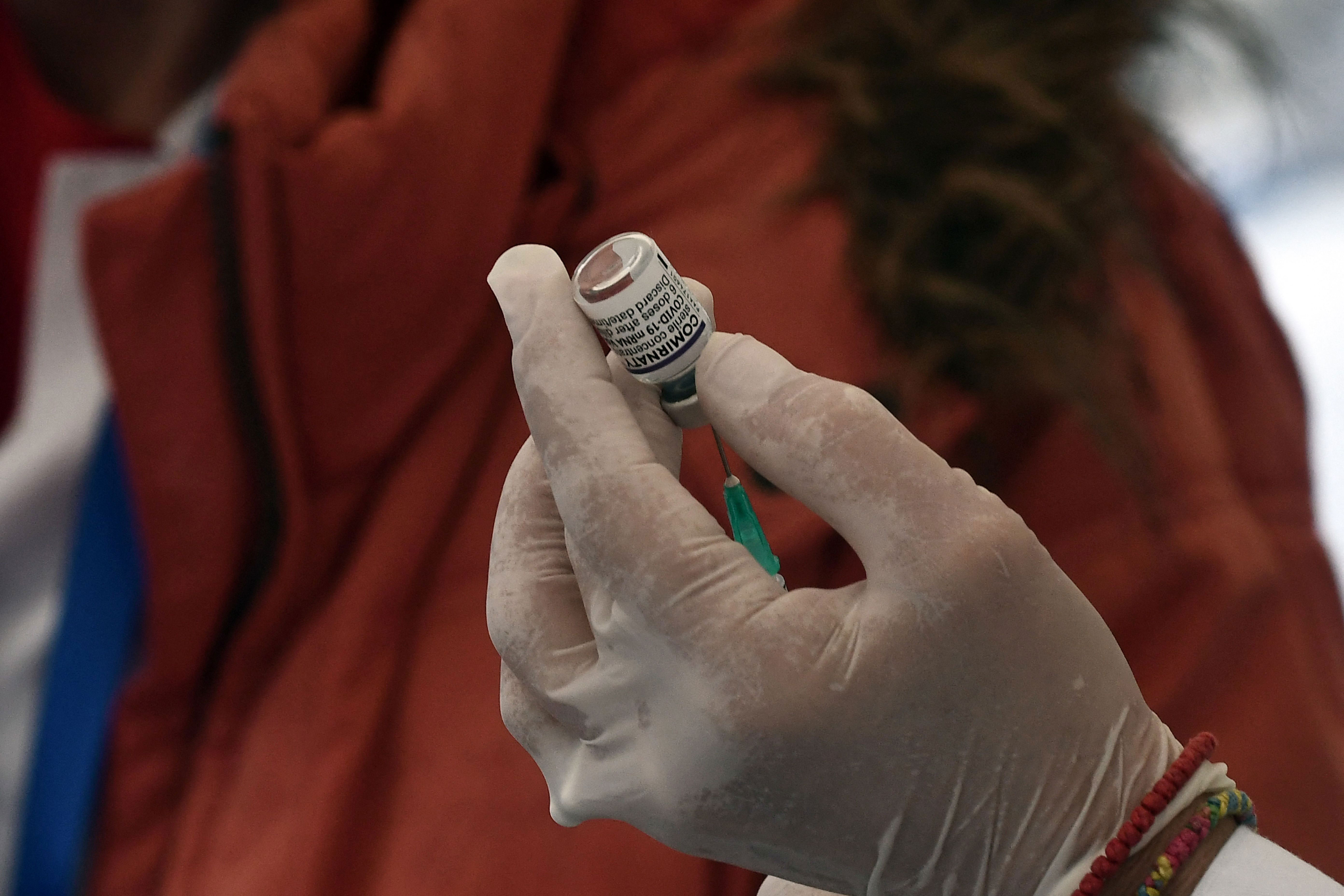 A health worker prepares a dose of the Pfizer-BioNTech vaccine in Thessaloniki on November 26.