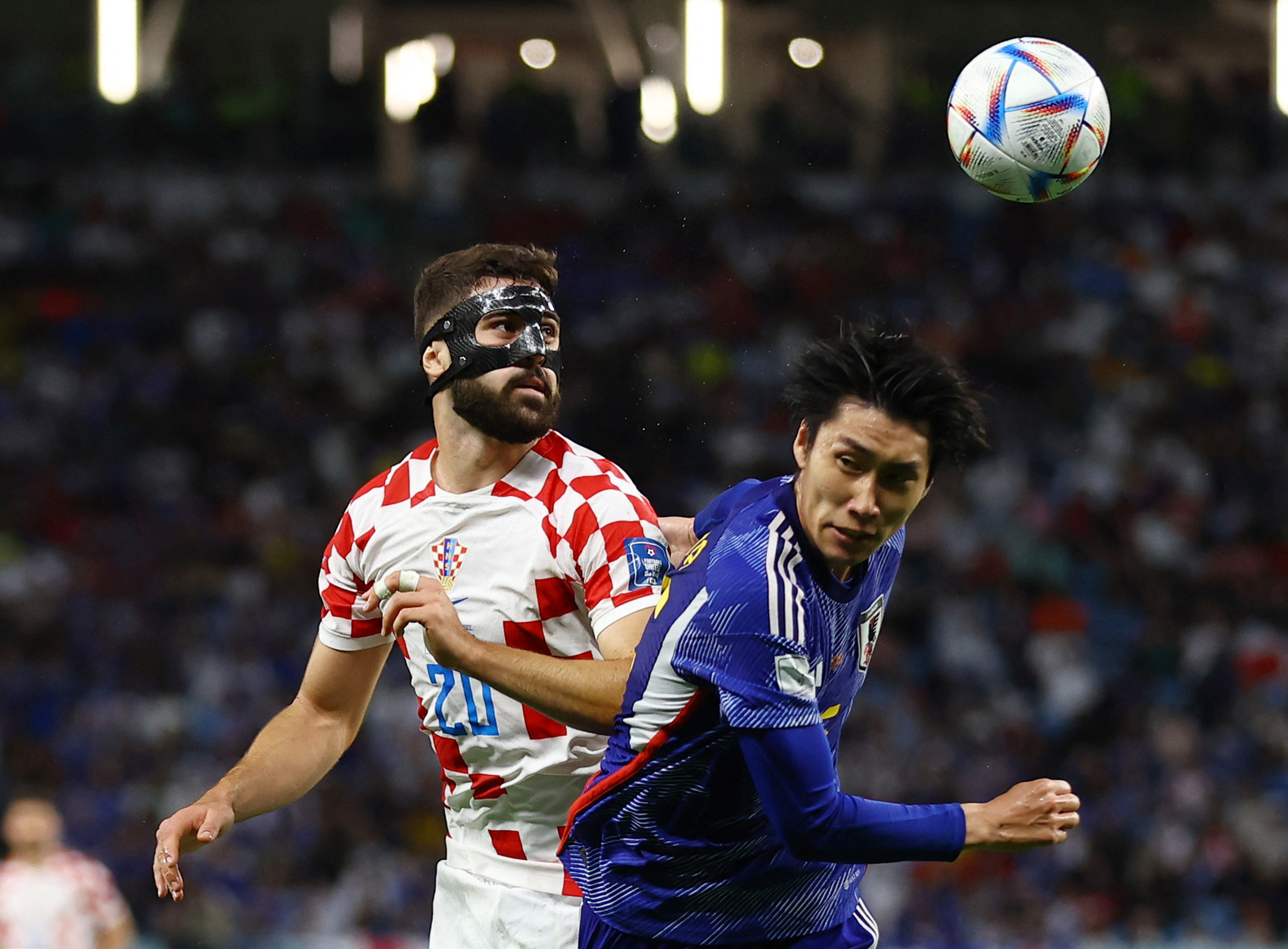 Croatia's Josko Gvardiol, left, in action with Japan's Daichi Kamada on Monday.