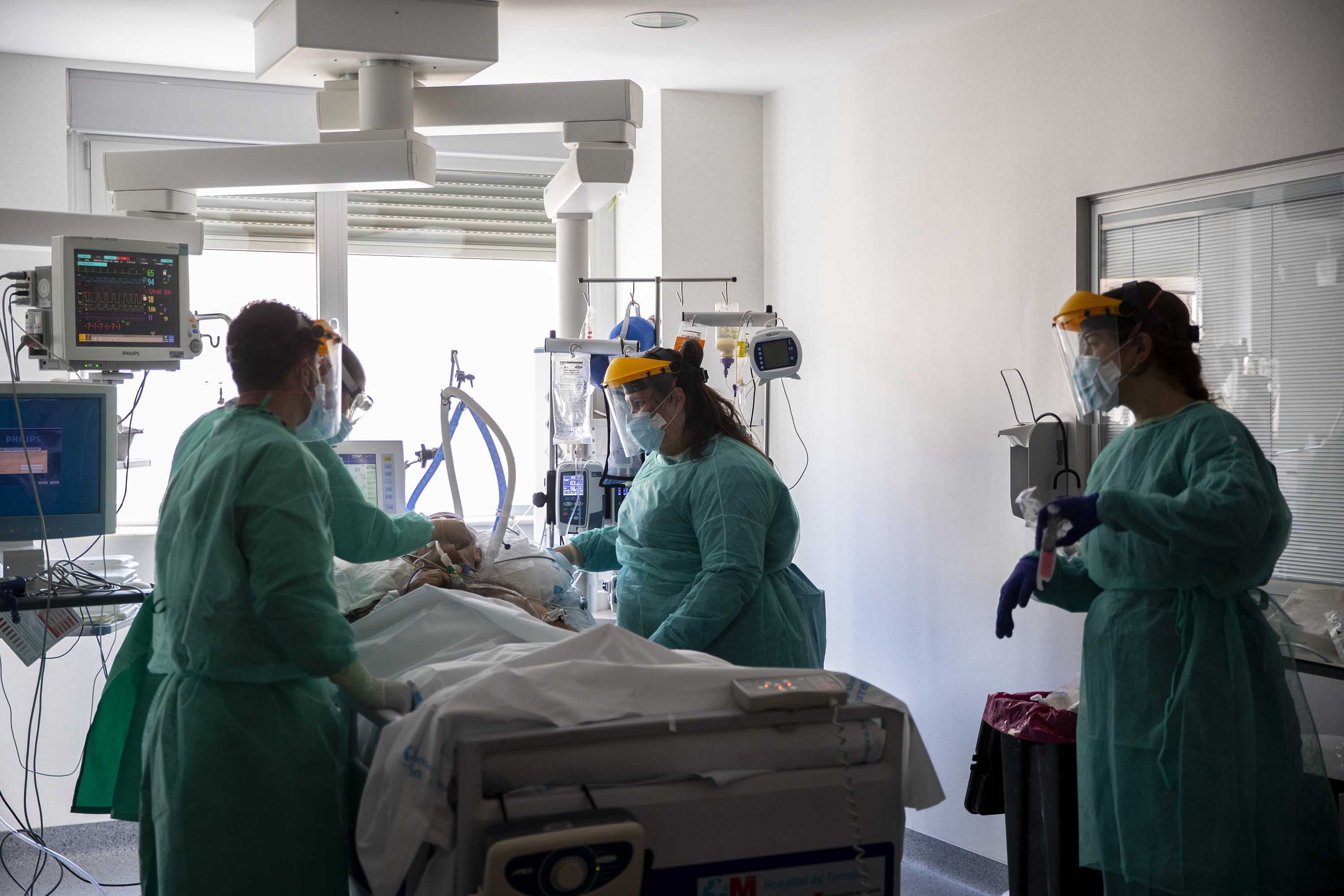 A patient infected with COVID-19 is treated in an intensive care unit at the University Hospital of Torrejon in Torrejon de Ardoz, Spain, on October 6.