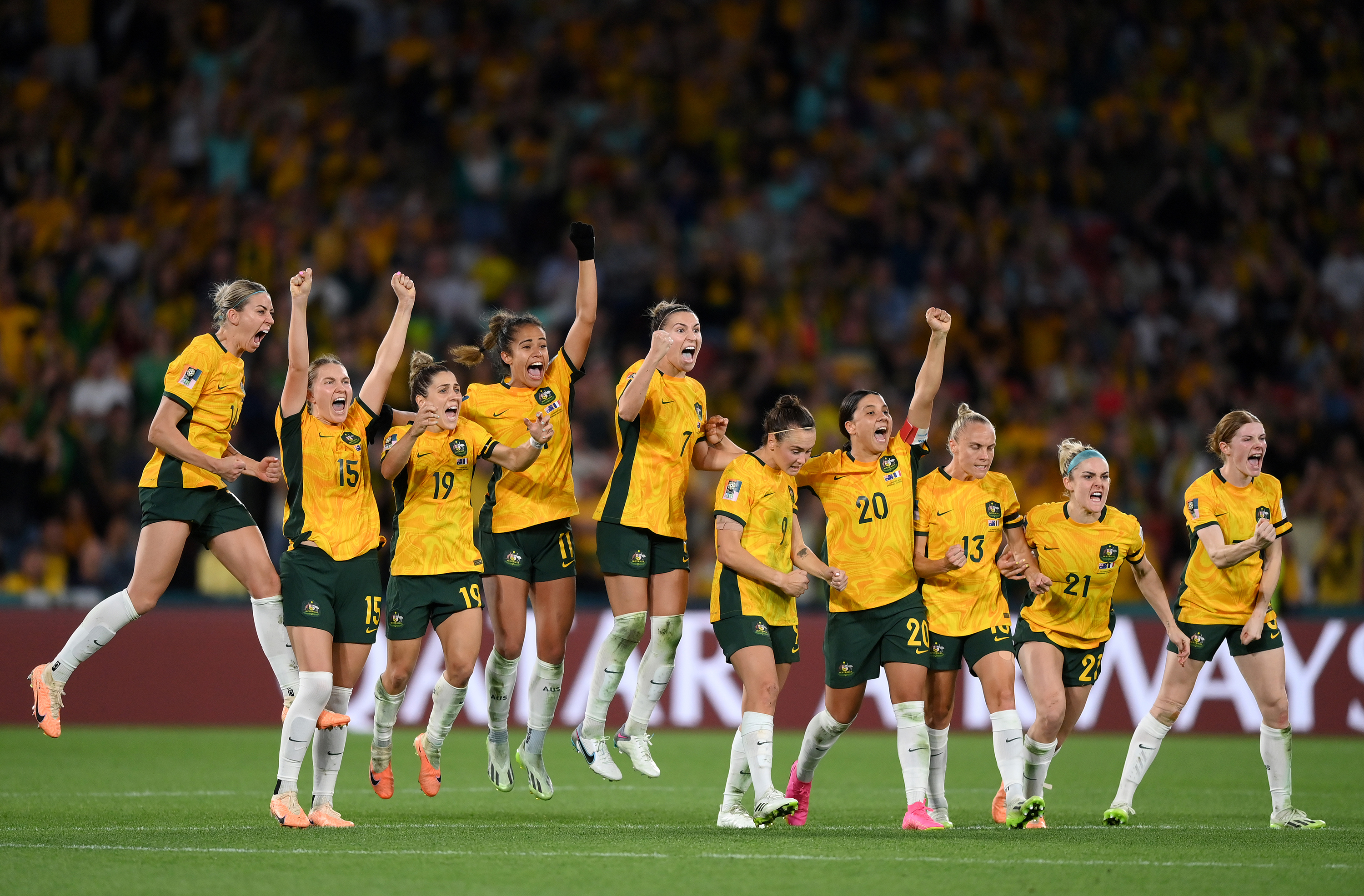 Players of Australia celebrate as Mackenzie Arnold of Australia saves the first penalty of France.