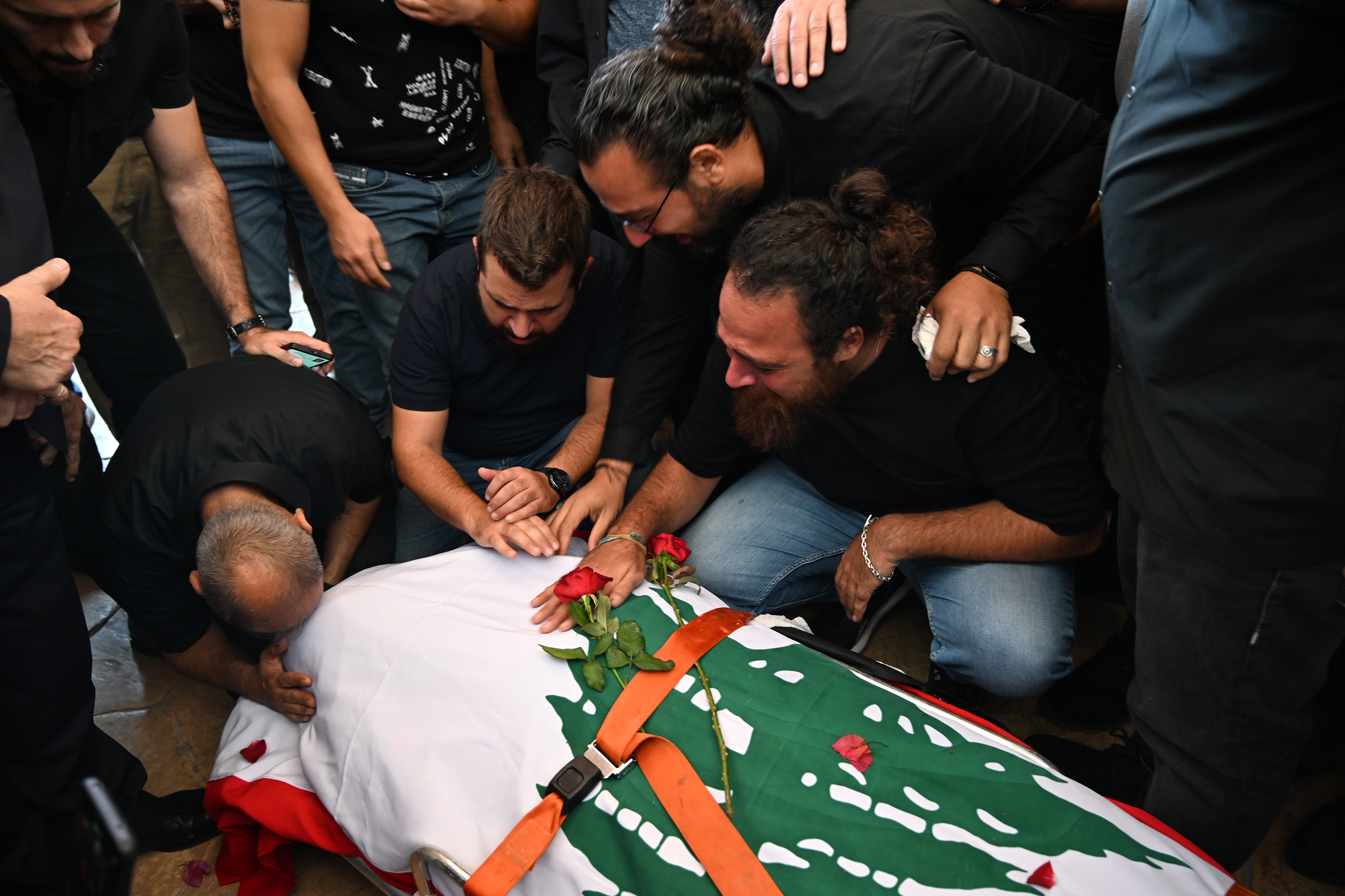 People mourn at the funeral ceremony of Reuters journalist Issam Abdallah in Khiam, Lebanon, on October 14. 