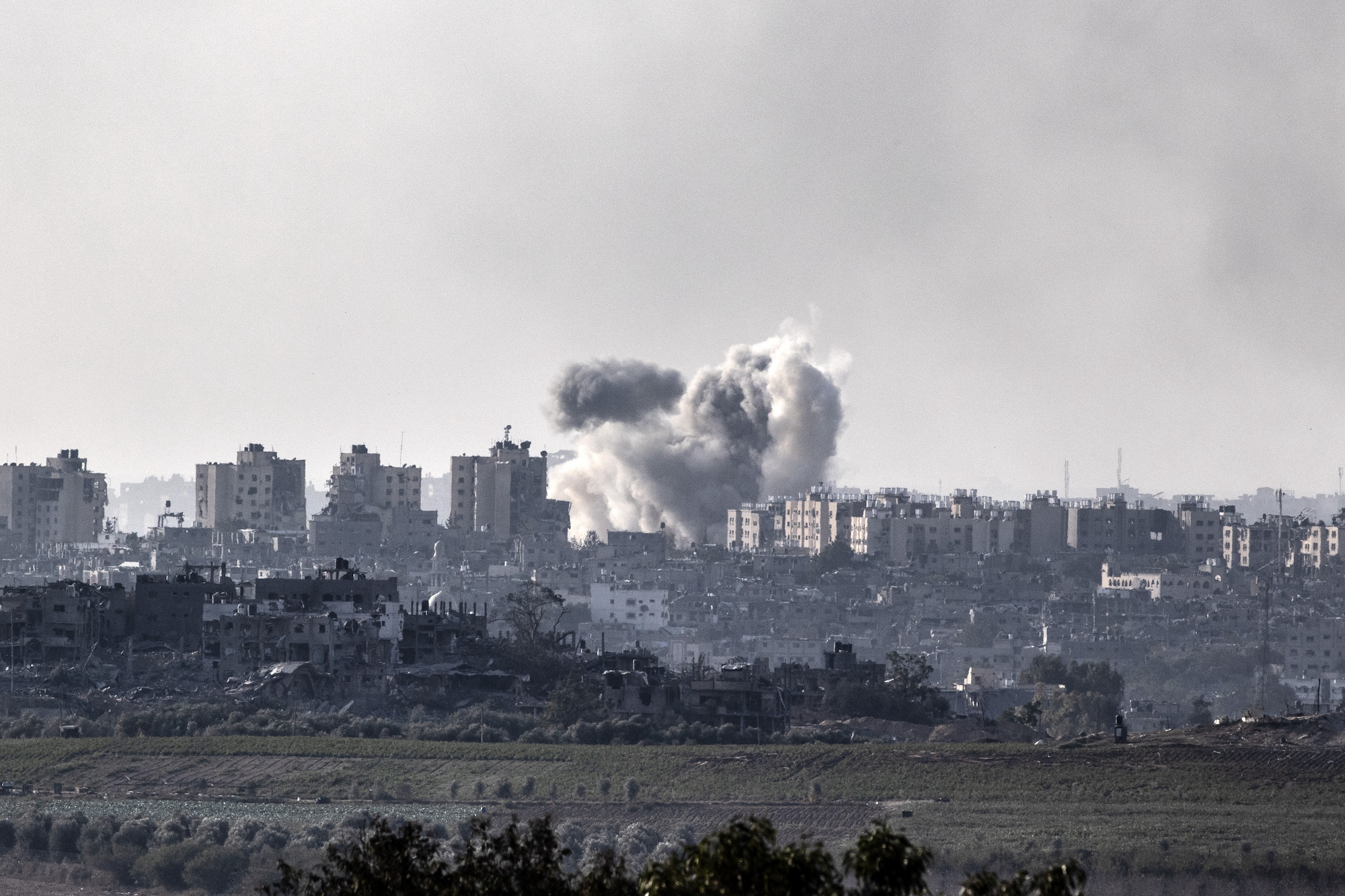 Smoke rises in Gaza as Israeli airstrikes continue on Monday.