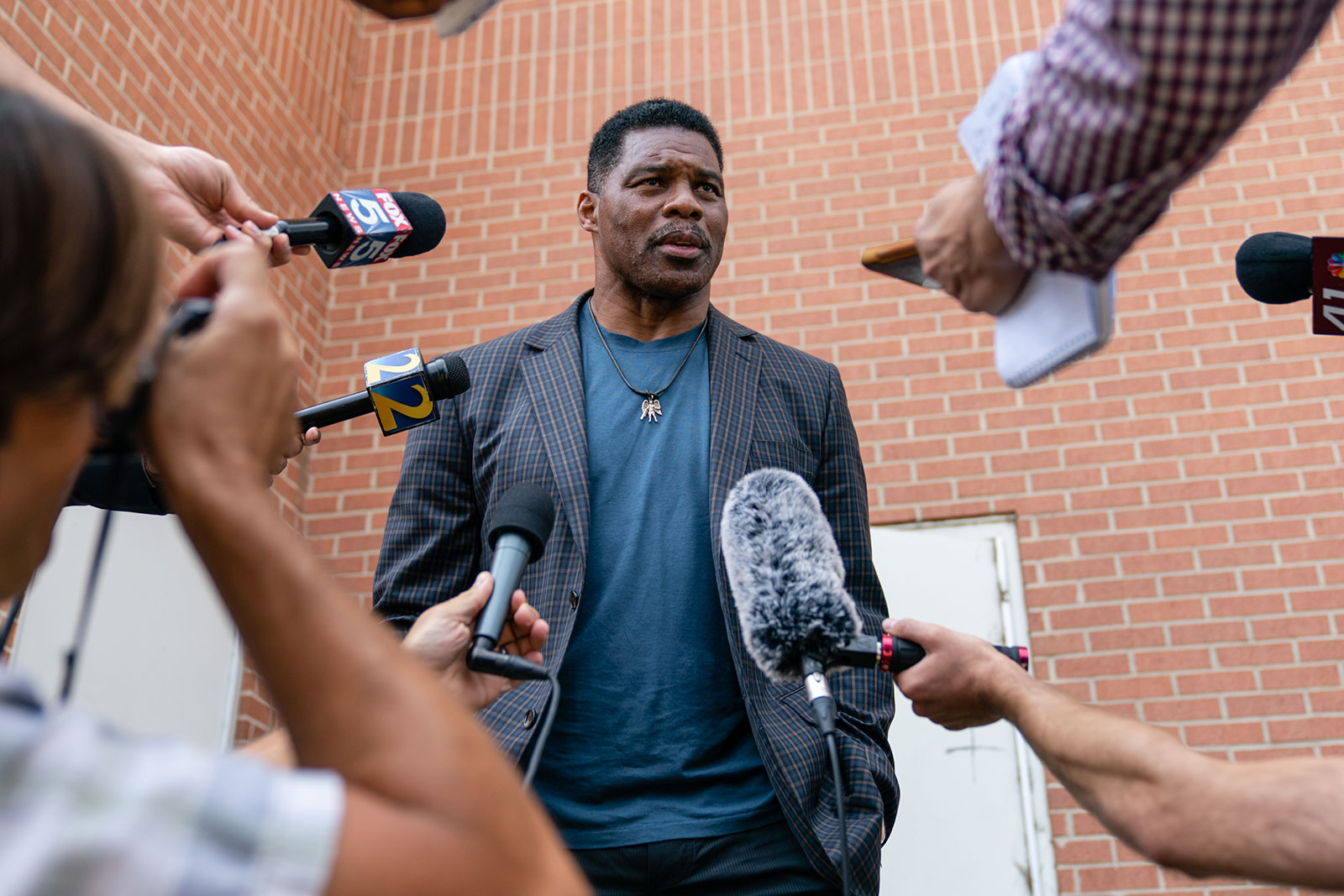 Herschel Walker speaks to members of the media following a campaign rally in Macon, Georgia, on May 18. 