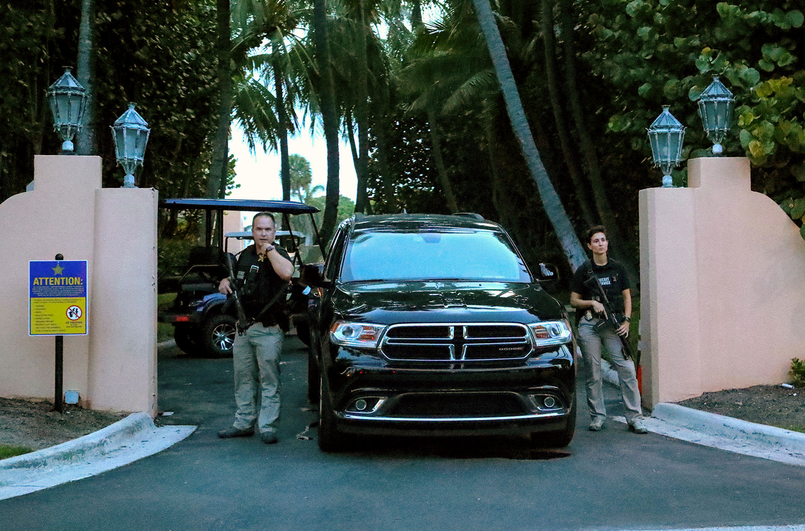 Secret Service agents stand outside an entrance to former President Donald Trump's Mar-a-Lago home Monday, August 8, in Palm Beach, Florida. 