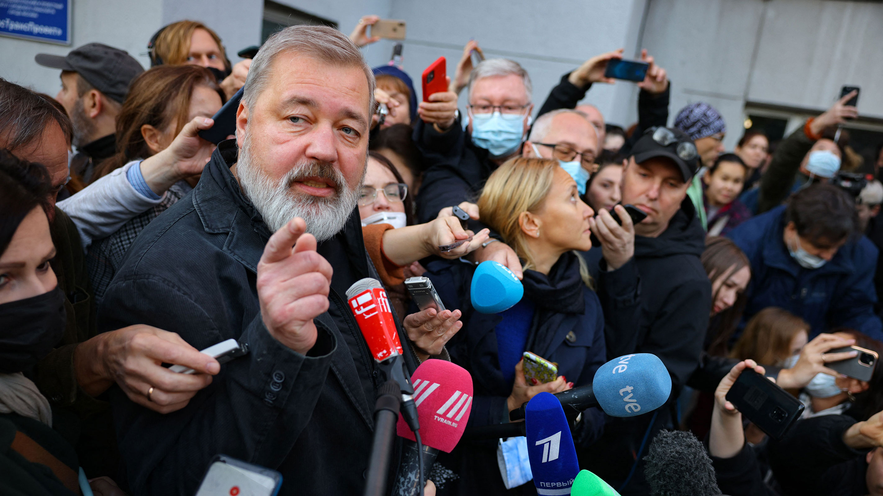 Russia's top independent newspaper Novaya Gazeta chief editor and the 2021 Nobel Peace Prize winner Dmitry Muratov meets with reporters outside the newspaper's office in Moscow on October 8, 2021.