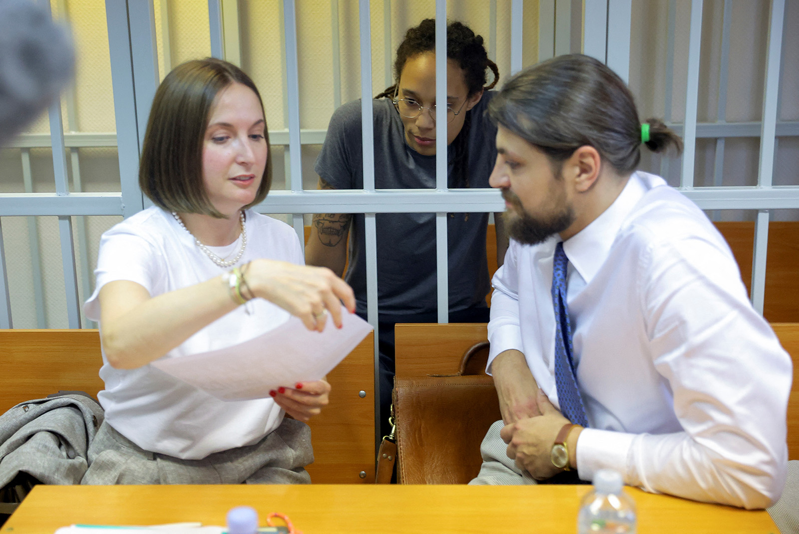 Attorneys Maria Blagovolina and Alexander Boykov and U.S. basketball player Brittney Griner speak before a court hearing in Khimki outside Moscow, Russia, on August 4.
