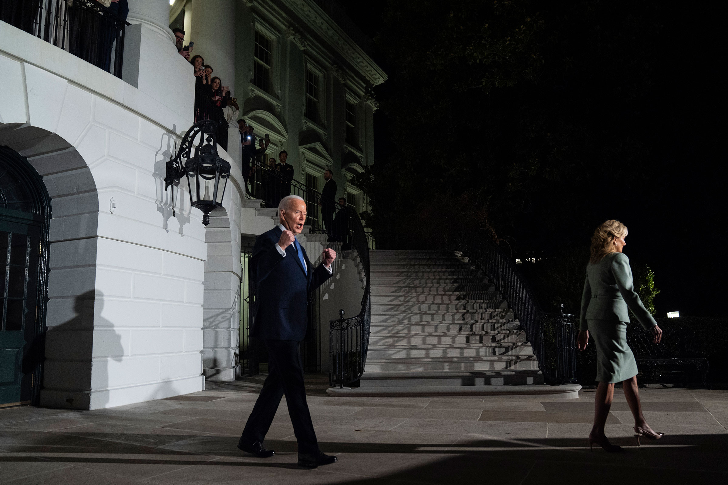 President Joe Biden pumps his fists as he and first lady Jill Biden depart the White House to travel to Capitol Hill to deliver the State of the Union speech on Thursday.