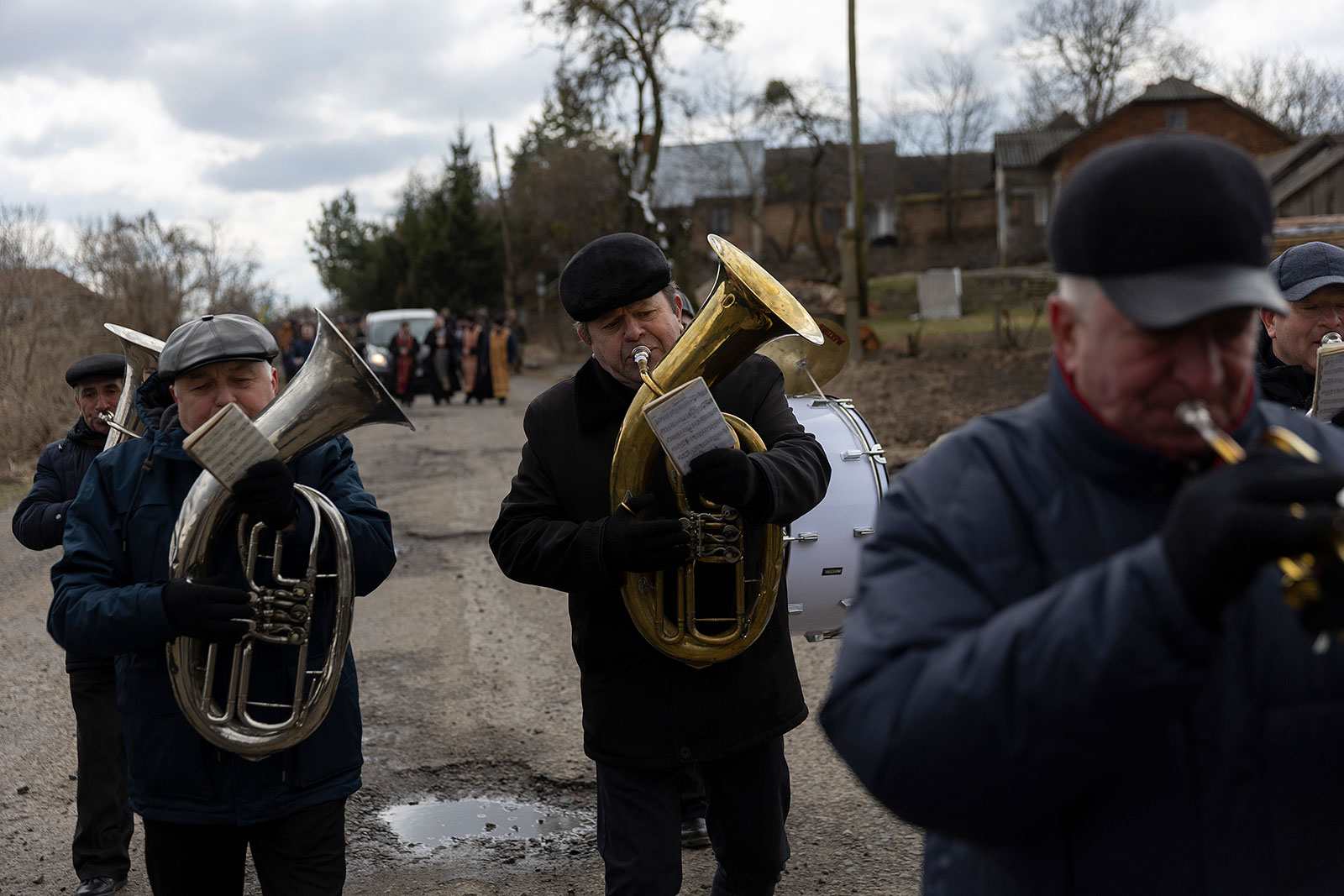 A band leads a funeral procession for Ukrainian soldier Dmitry Zhelisko to the cemetery on April 03.