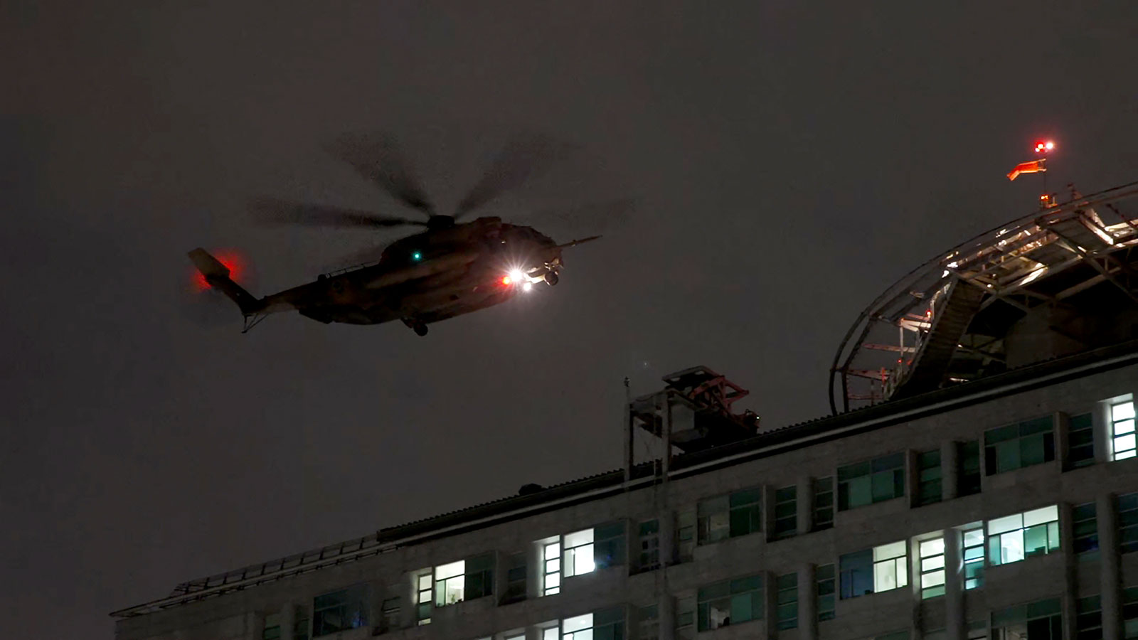 CNN’s team outside the Ichilov Hospital in Tel Aviv saw a helicopter with an unidentified number of hostages landing at the top of the facility.
