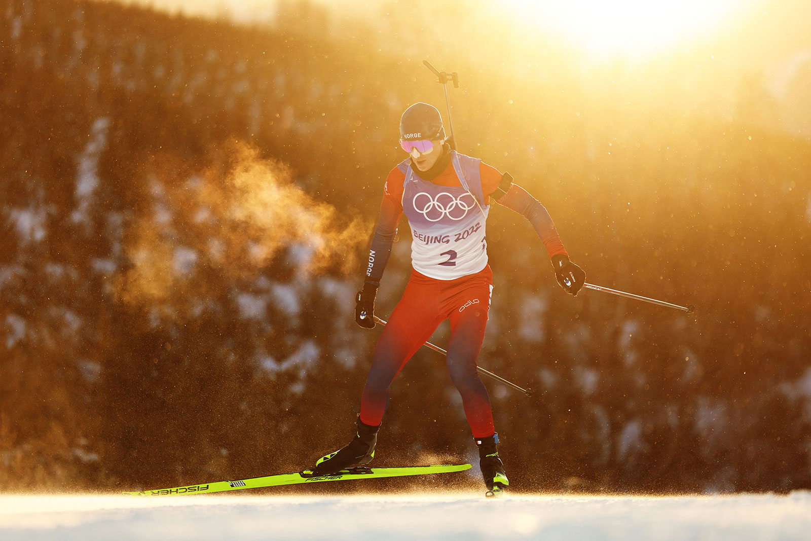 Johannes Thingnes Bø skis during his gold medal performance in the men's biathlon 15km mass start on February 18.