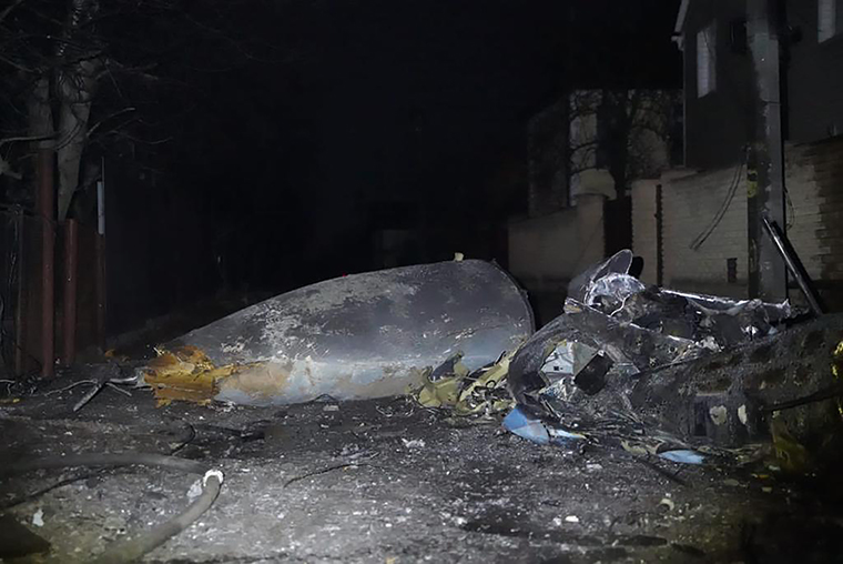 Photos tweeted by the Ukrainian emergency forces appear to show a fire at a private home after fragments of a plane fell on it. It's unclear if those are the remnants of the Su-27 jet.