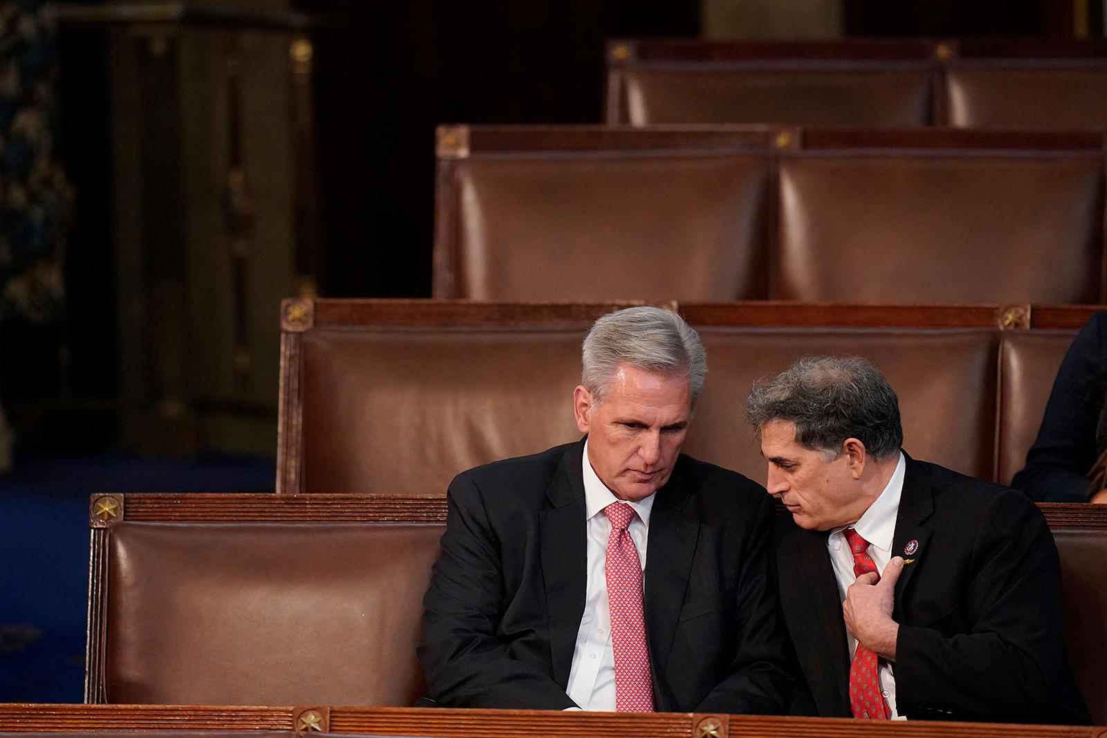 Republican leader Kevin McCarthy, left, talks with US Rep. Andrew Clyde after a failed seventh vote for the speakership on Thursday, January 5. Clyde, from Georgia, is one of the Republicans who has voted against McCarthy getting the speakership.