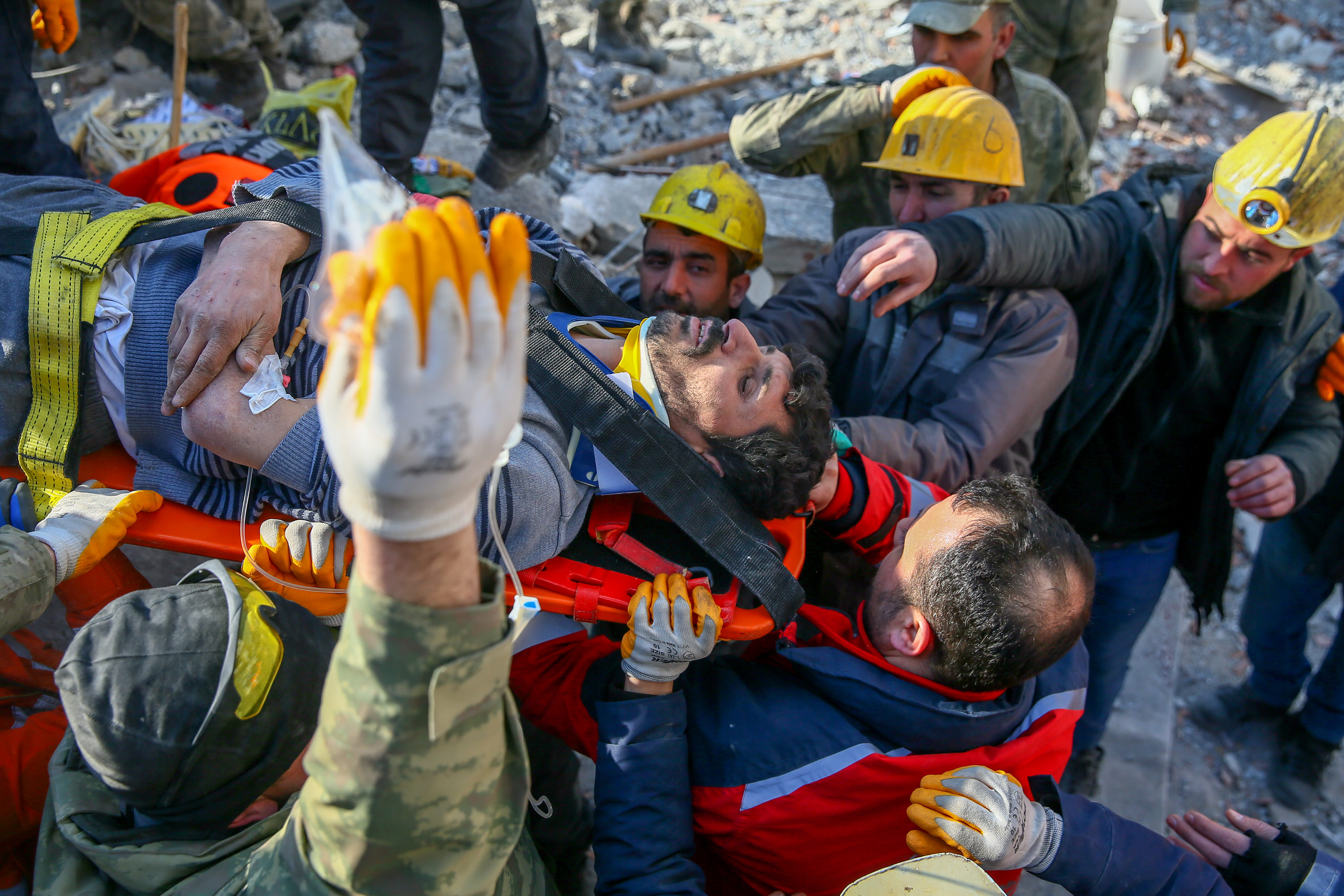 Sezai Karabas is put on a stretcher after being rescued from rubble on Saturday, February 11, in Gaziantep, Turkey. Karabas' daughter Sengul was also rescued. 