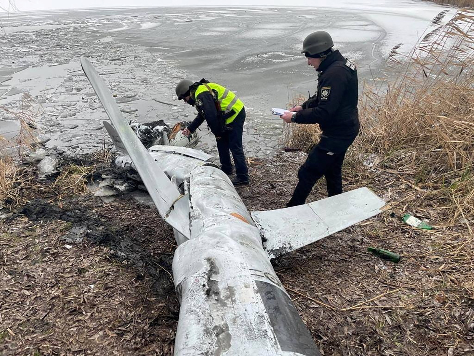 Police officers inspect a Russian cruise missile shot down by the Ukrainian Air Defence Forces in Kyiv, Ukraine, on January 26.