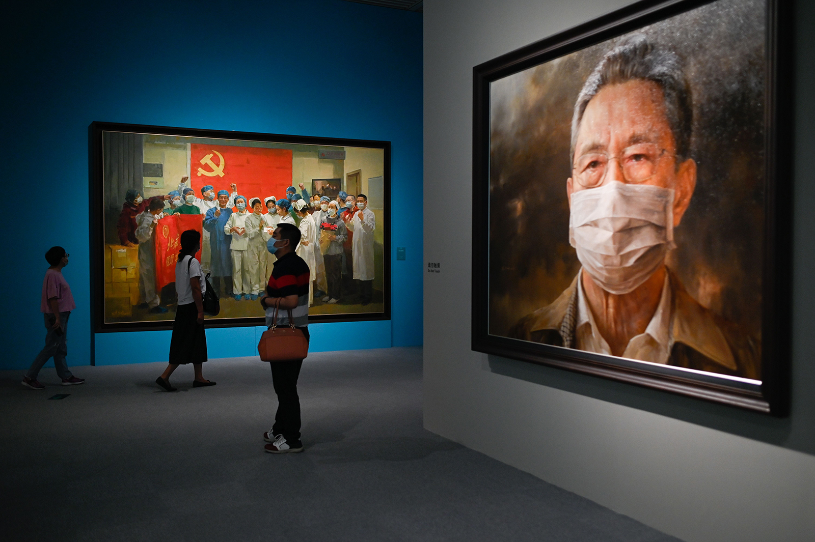 People visit an art exhibition on the fight against Covid-19 at the National Museum of China in Beijing on August 5.