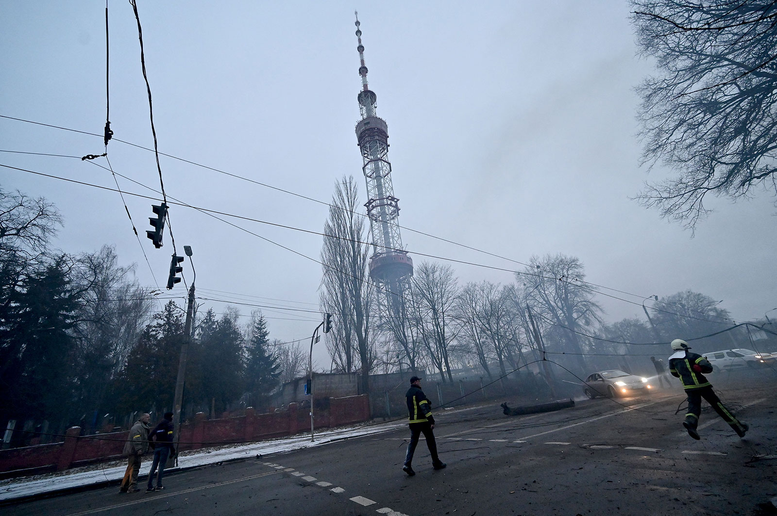 A fireman runs towards the Kyiv TV tower after a shelling on March 1.