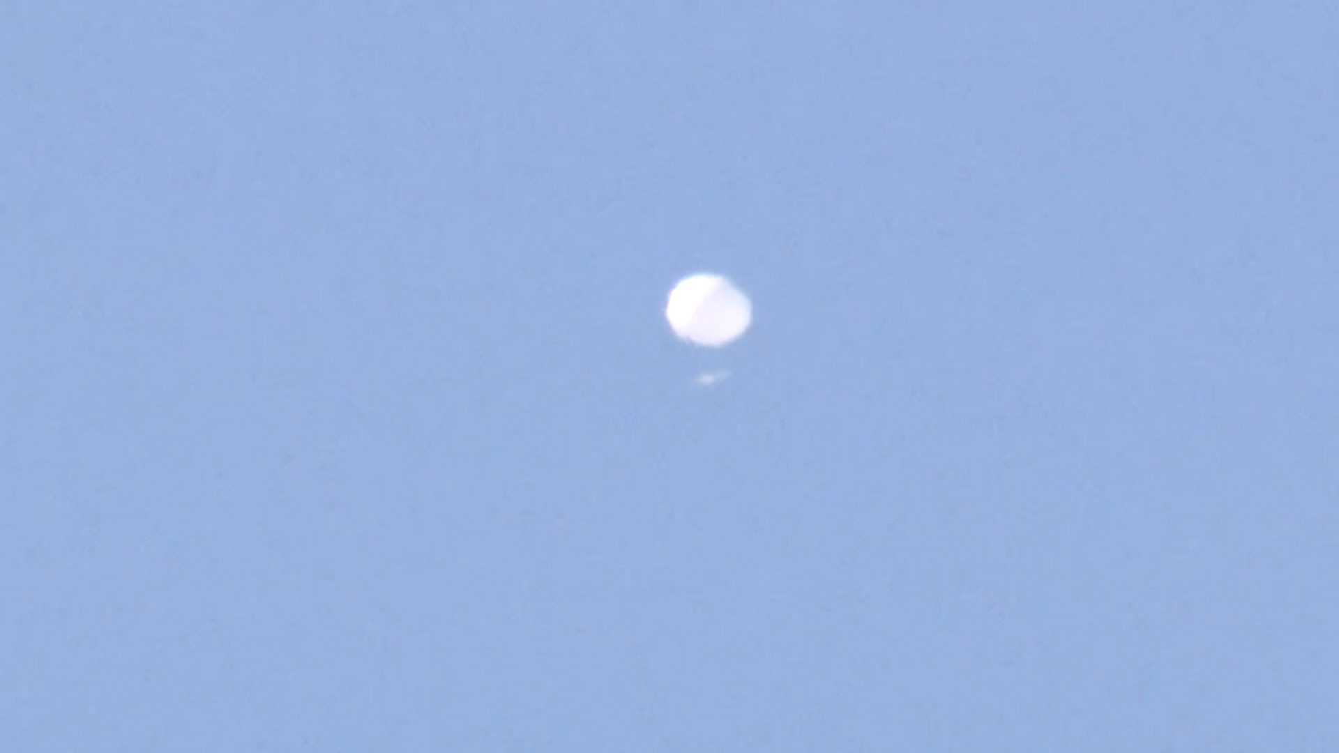 The suspected Chinese spy balloon appears above Charlotte. 