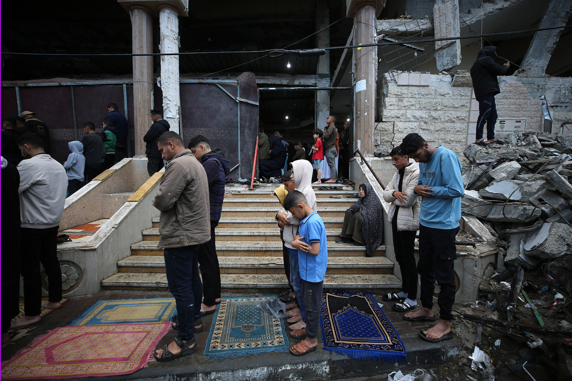 Muslims gather to perform Eid al-Fitr prayers at al-Huda mosque, which was heavily damaged after Israeli attacks in Rafah, Gaza, on April 10.