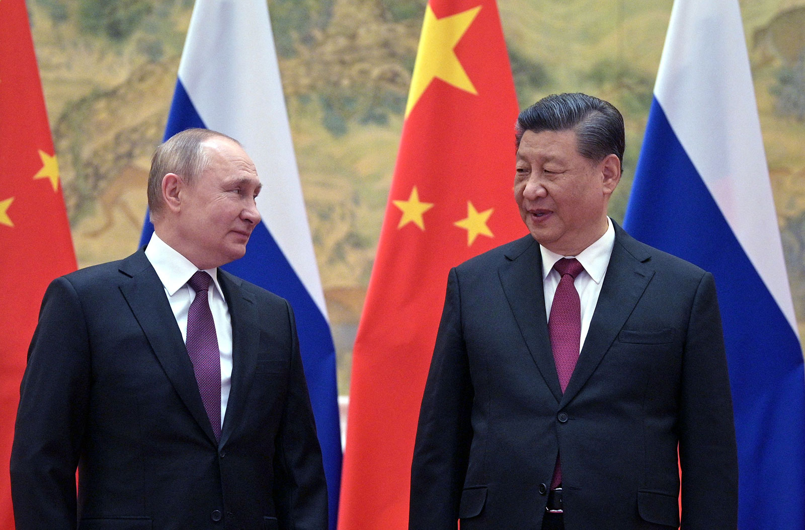 Russian President Vladimir Putin and China's President Xi Jinping pose for a photo during a meeting in Beijing on February 4.