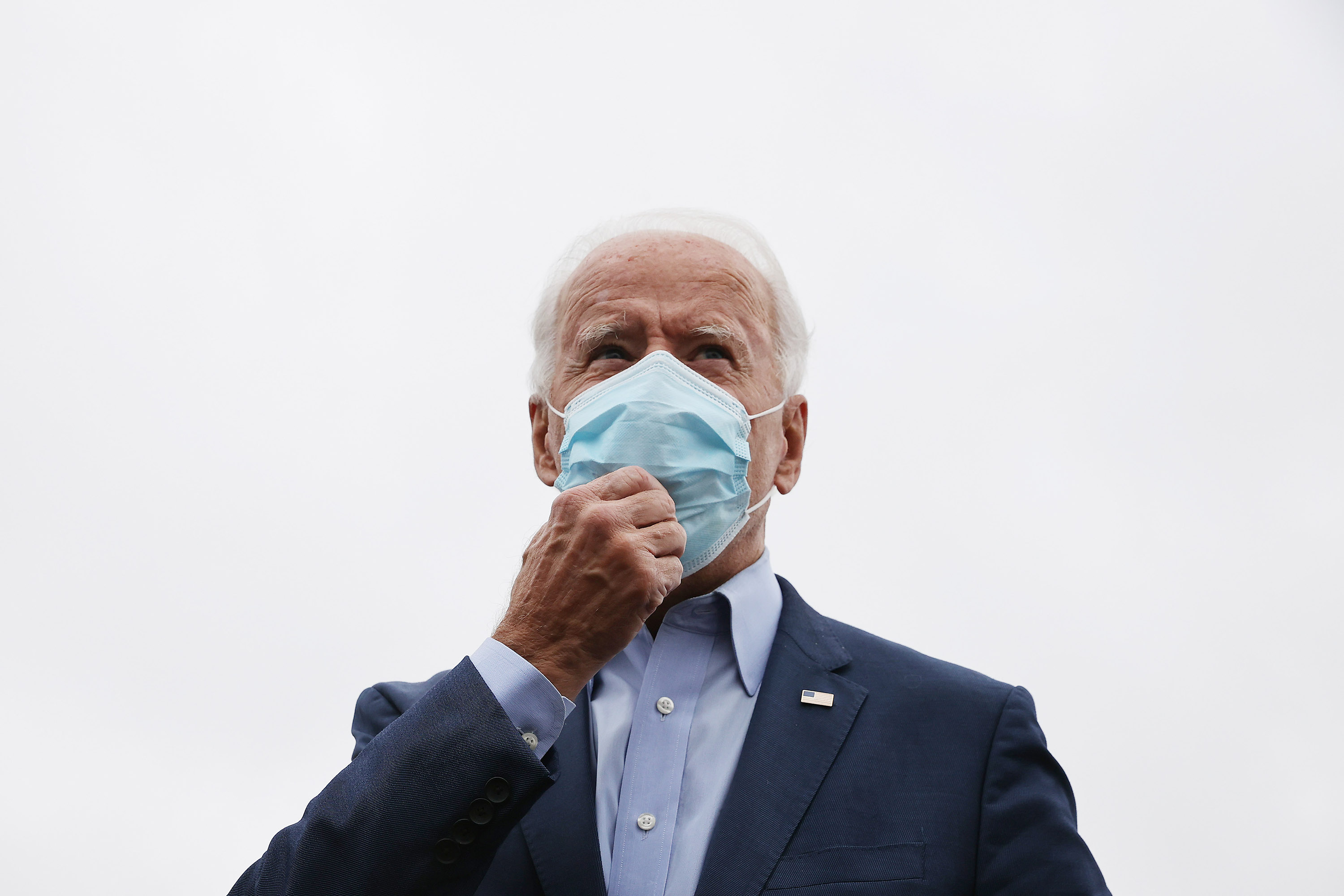 Democratic presidential nominee Joe Biden talks to reporters before boarding a flight to Ohio at New Castle County Airport in New Castle, Delaware, on Monday, October 12.