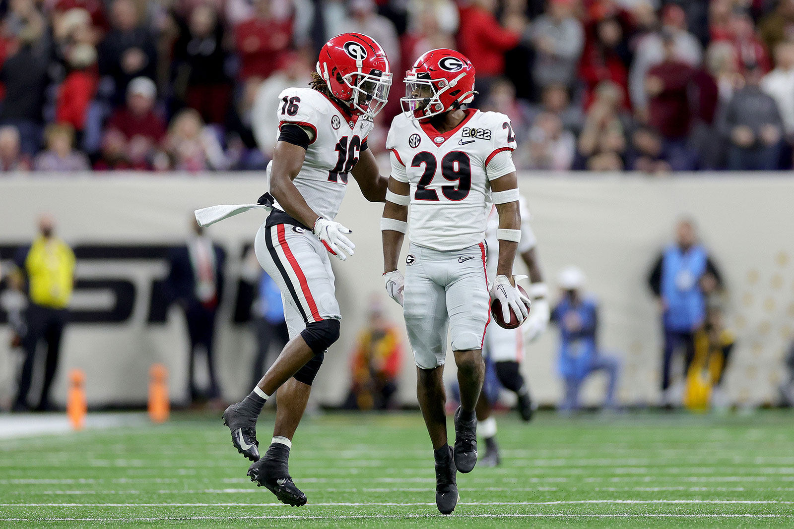 Christopher Smith celebrates with teammate Lewis Cine after intercepting a pass by Alabama's Bryce Young in the third quarter.