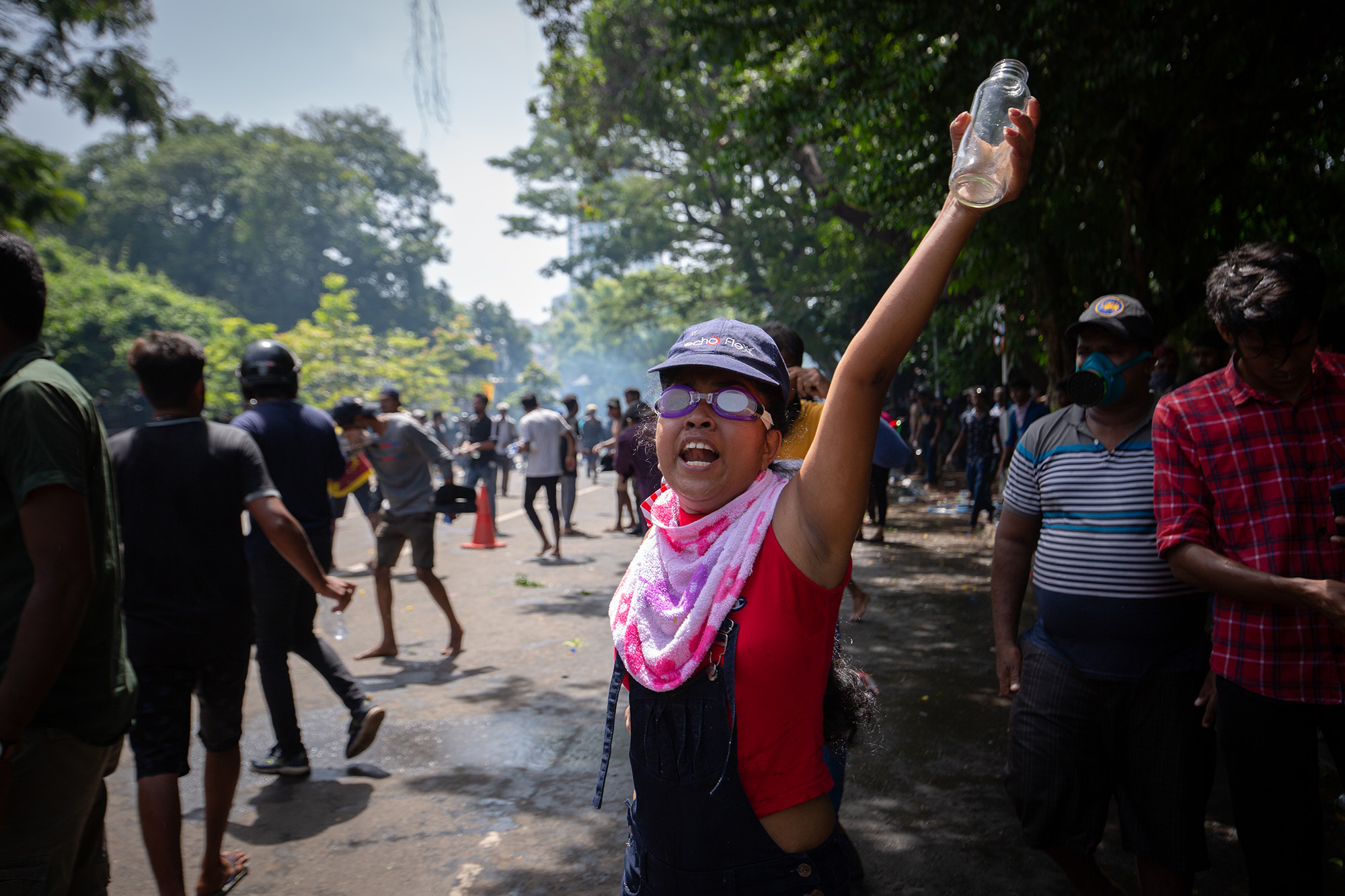 A protester wearing swimming goggles shouts slogans during a protest outside the office of Sri Lanka's Prime Minister Ranil Wickremesinghe on July 13, in Colombo, Sri Lanka. 