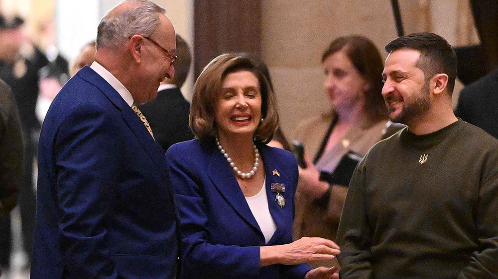 US Senate Majority Leader Chuck Schumer and US House Speaker Nancy Pelosi  chat with Ukraine's President Zelensky at the US Capitol in Washington, DC on Wednesday, December 21.