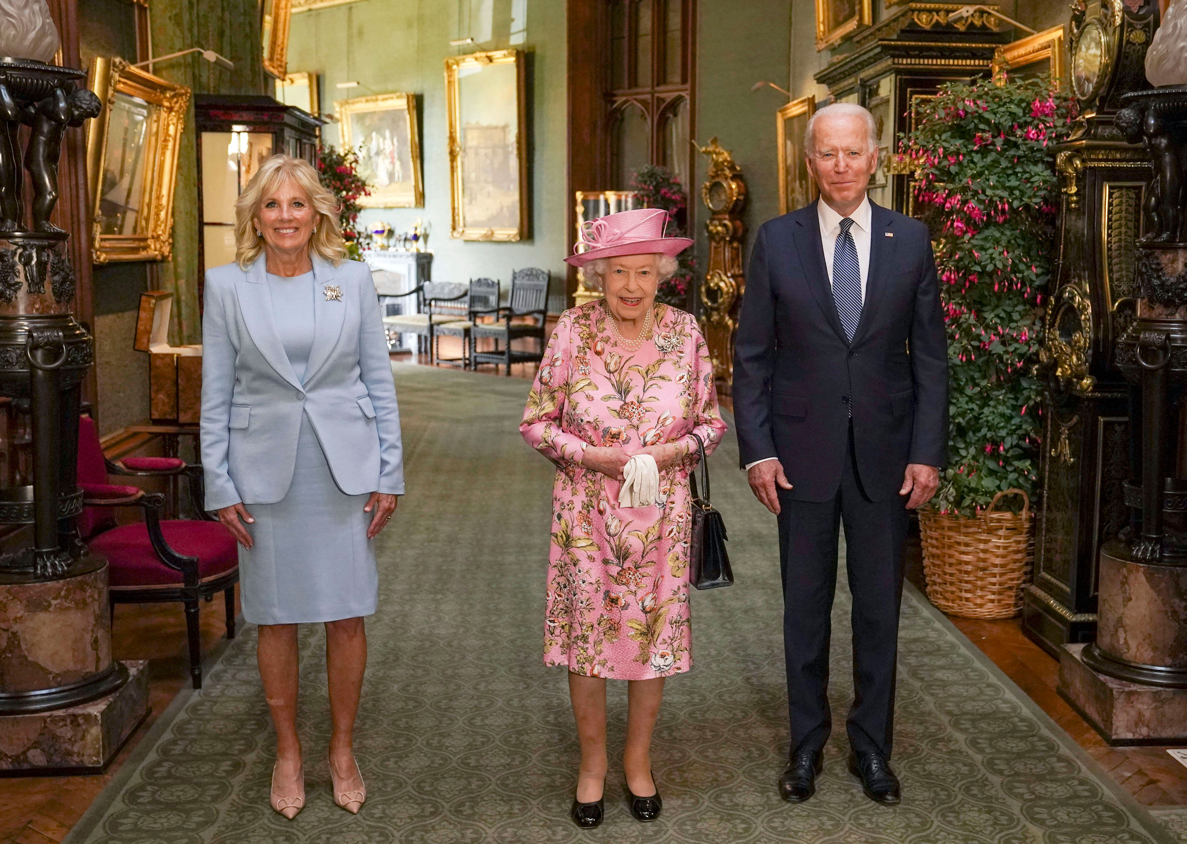 Queen Elizabeth II stands for a photo with US President Joe Biden and first lady Jill Biden in the Grand Corridor during their visit to Windsor Castle in England on June 13.