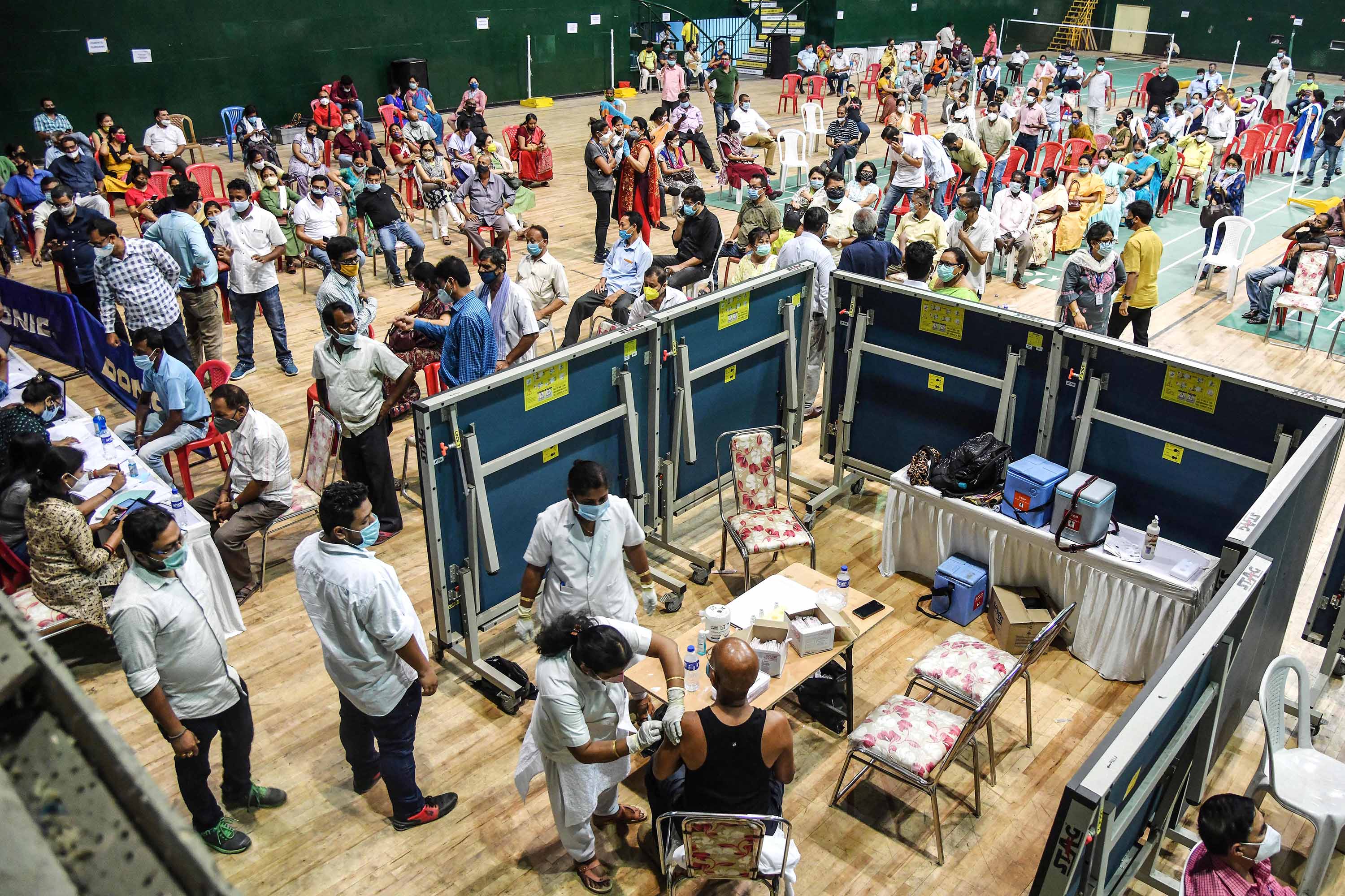 Vaccinations are carried out at an indoor stadium in Guwahati, India, on April 22. 