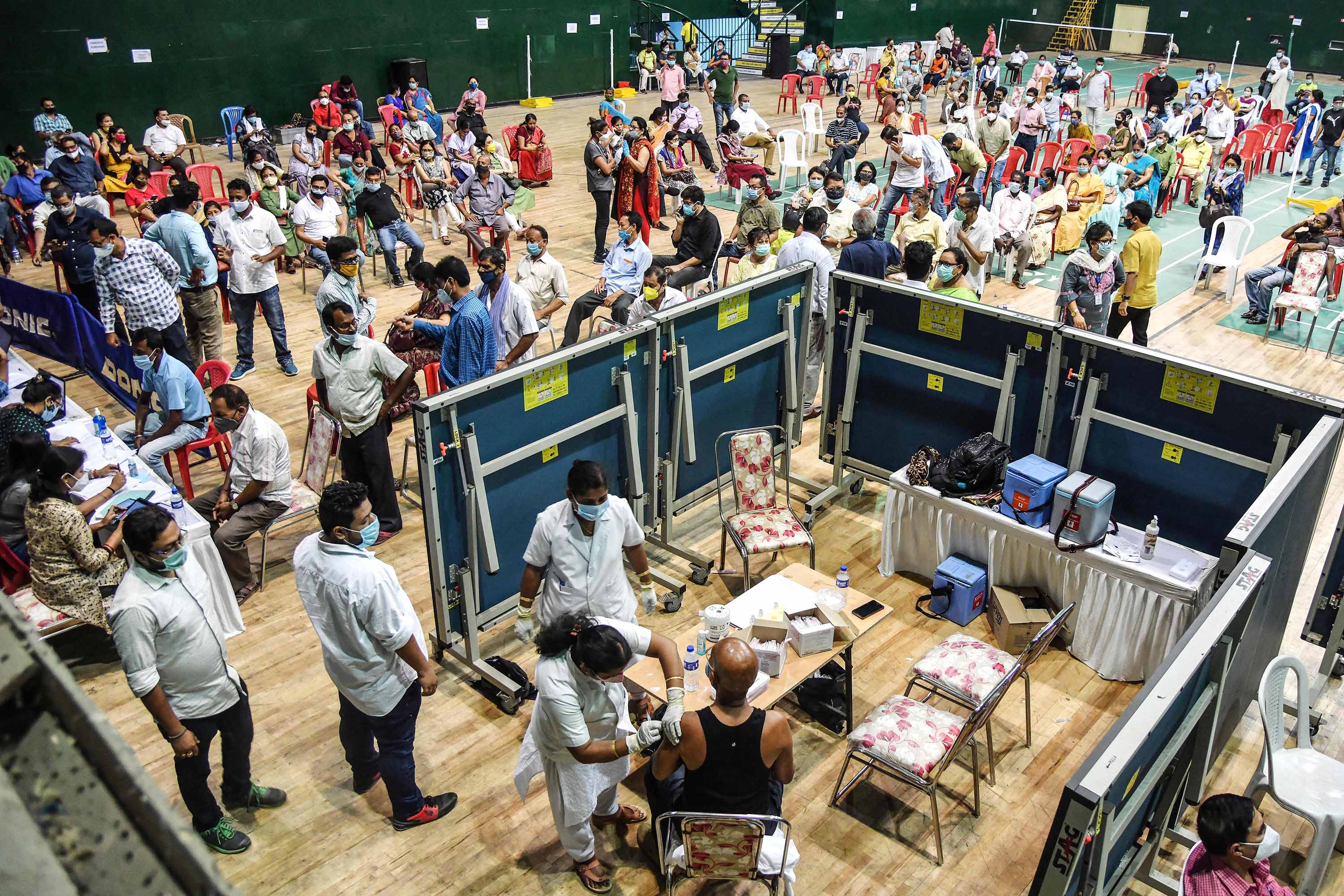 Vaccinations are carried out at an indoor stadium in Guwahati, India on April 22. 