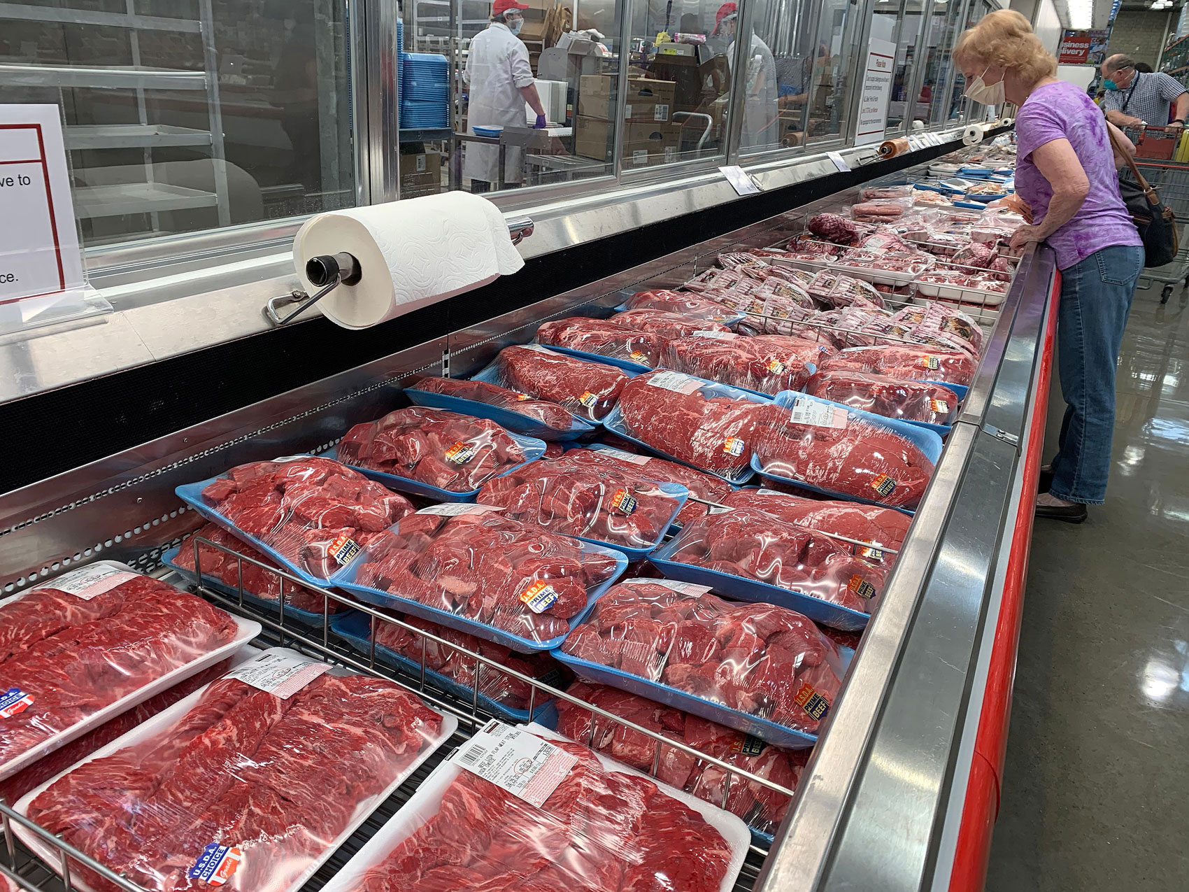 Shoppers view prime and choice meat selections in the meat department at a Costco Wholesale in Vacaville, California, on April 29.