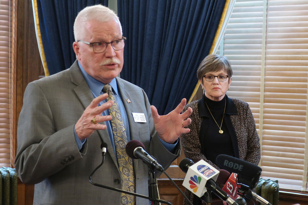Dr. Lee Norman, secretary for the Kansas Department of Health and Environment, answers questions about the coronavirus pandemic with Gov. Laura Kelly during a news conference on Monday, March 23.