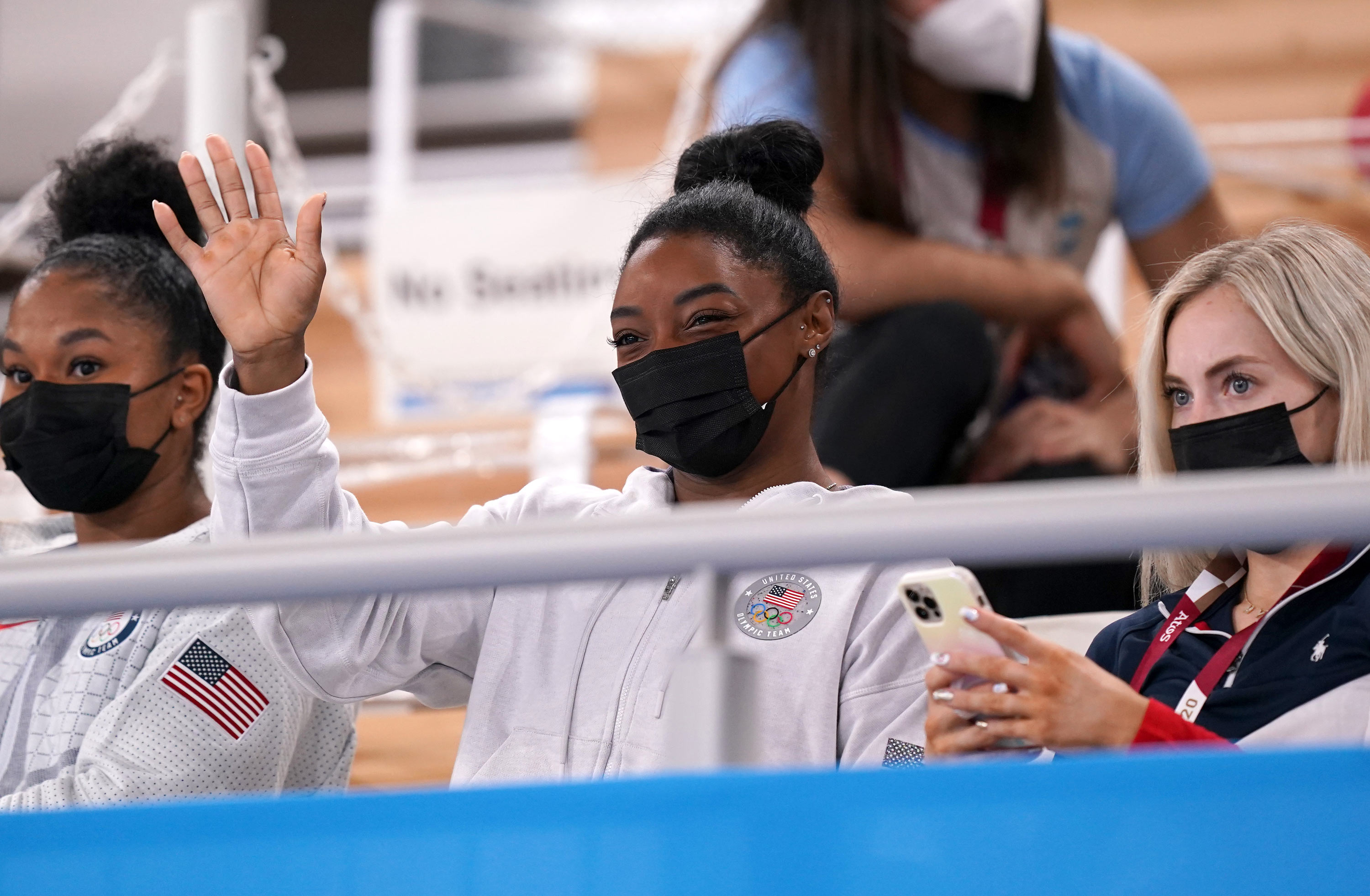 USA's Simone Biles waves from the the stands during the all-around gymnastics final on July 29.