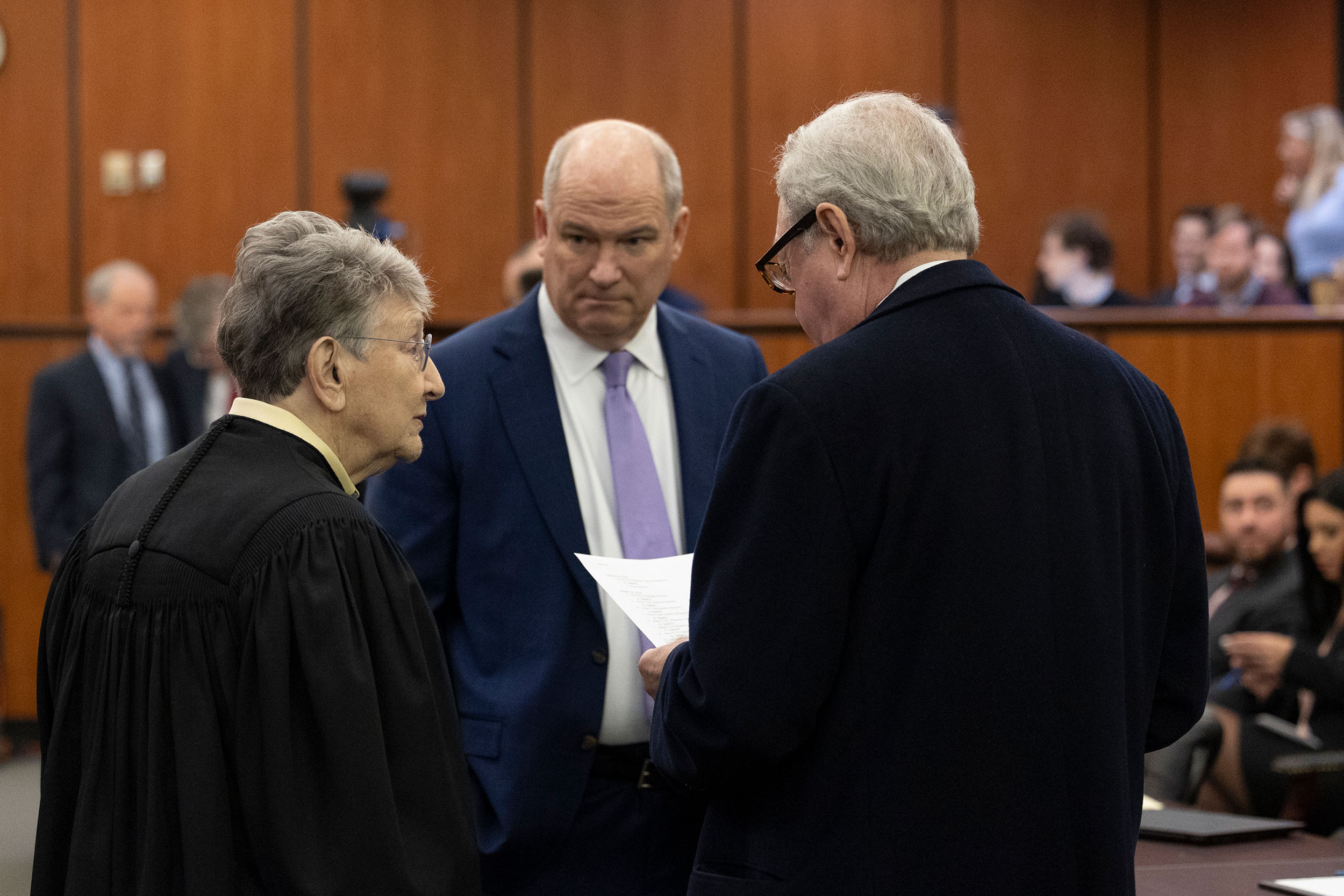 From left, Judge Jean Toal speaks with defense attorneys Jim Griffin and Dick Harpootlian before a judicial hearing at the Richland County Judicial Center in Columbia, South Carolina, on Monday.