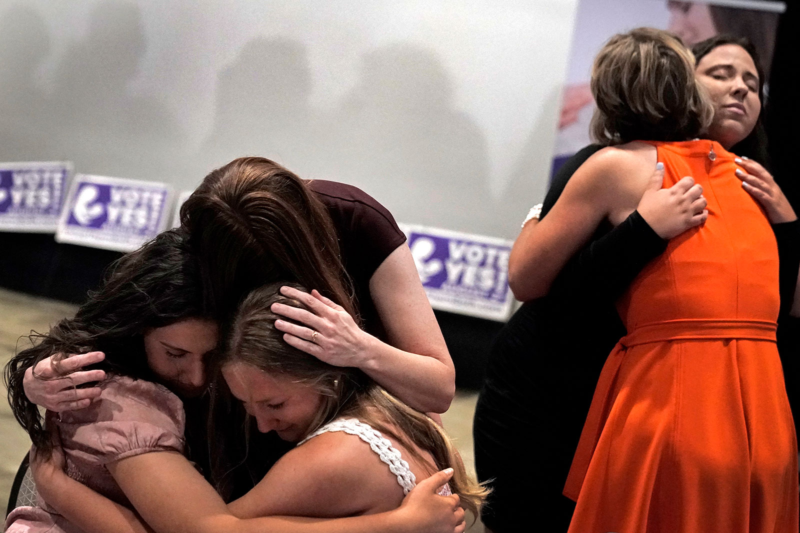 People hug during a "Value Them Both" watch party in Overland Park, Kansas, on Tuesday, August 2. 