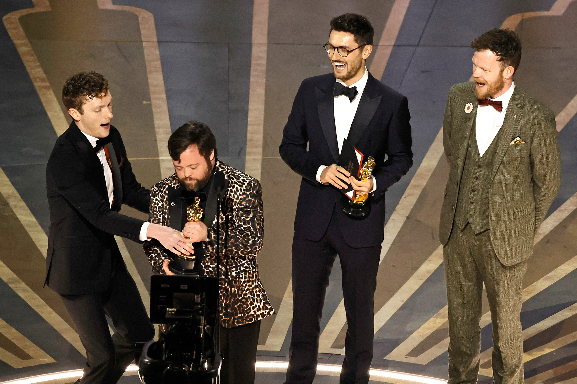 James Martin, second from left, holds the award for best live action short film while the audience sings him "Happy Birthday". 