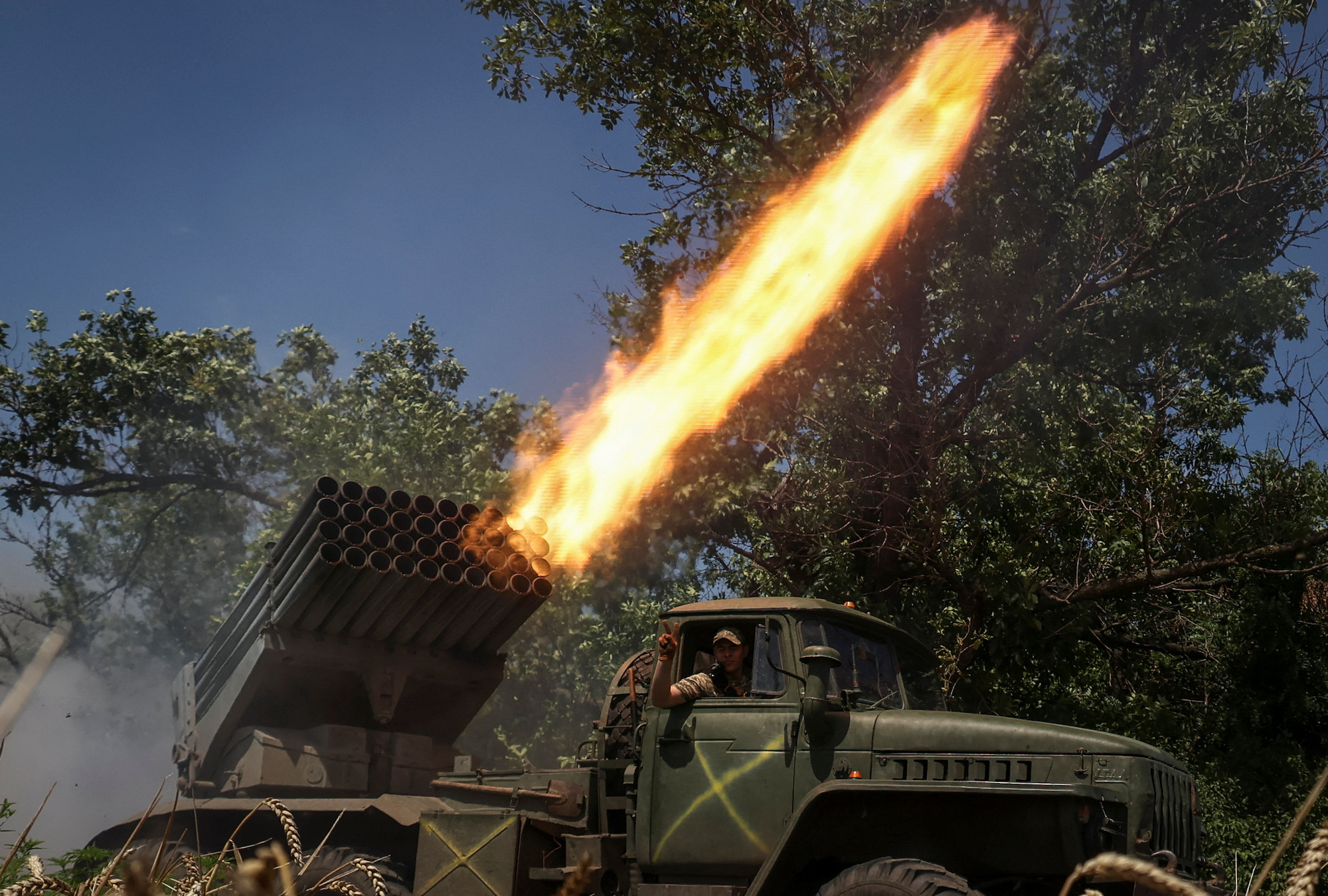 Ukrainian servicemen fire rockets towards Russian troops in the Donetsk region on July 18.