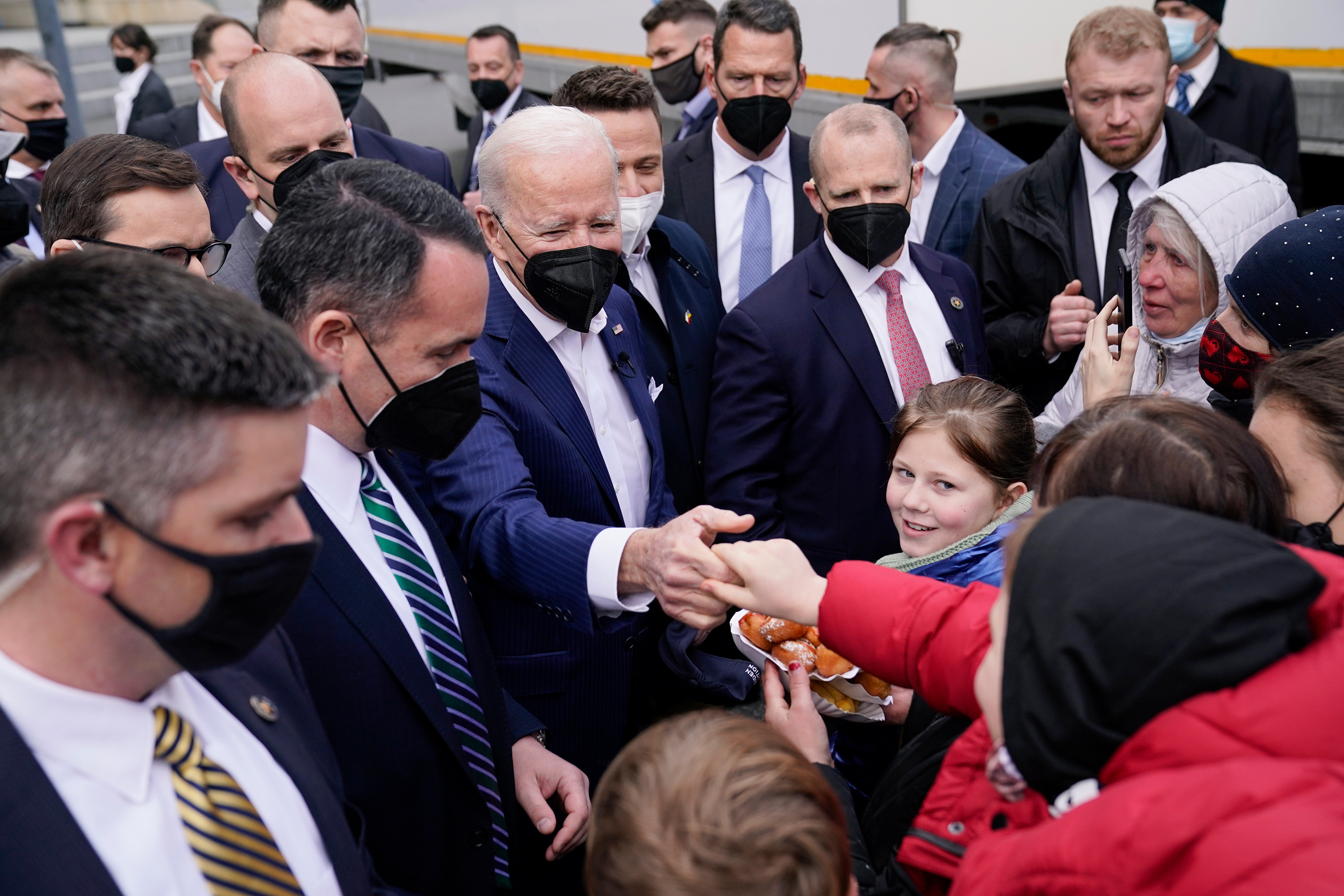 President Joe Biden meets with Ukrainian refugees and humanitarian aid workers on March 26 in Warsaw, Poland. 
