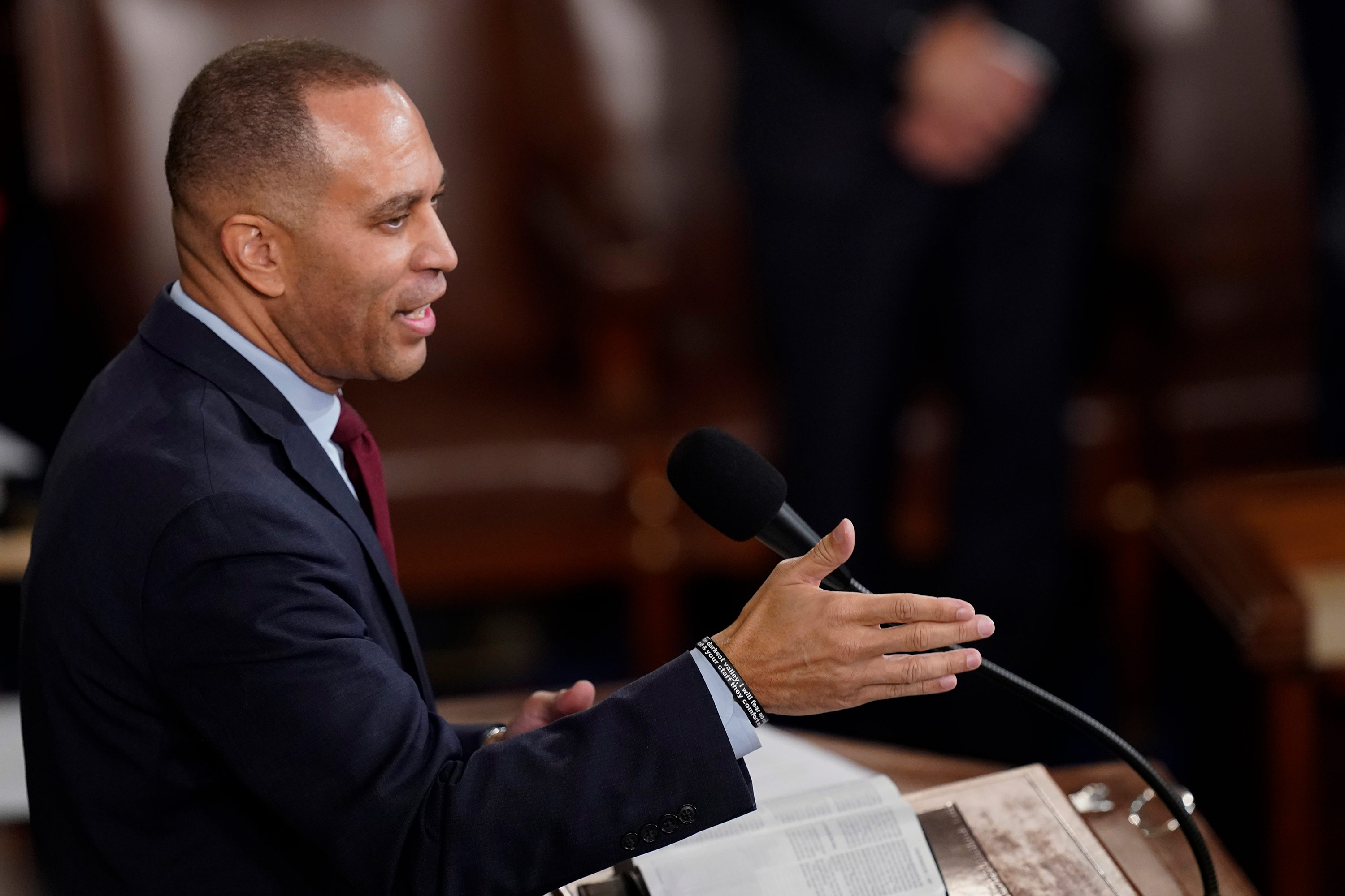 Rep. Hakeem Jeffries speaks in the House chamber early Saturday morning. 