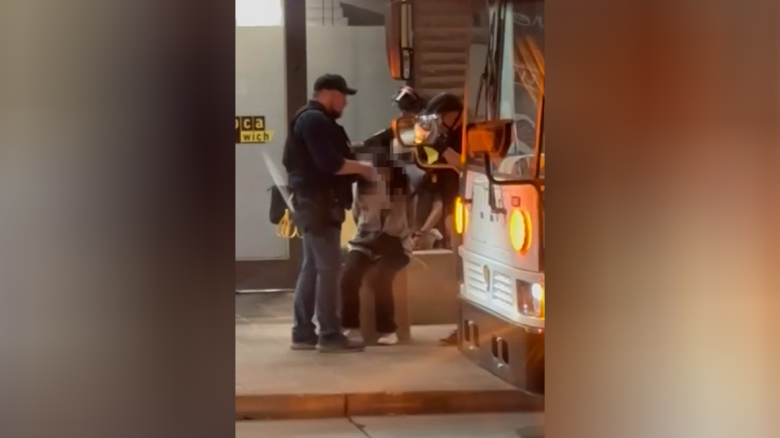 This screengrab shows a campus police officer removing a hijab off a protester’s head at Arizona State University, Phoenix, Arizona. 