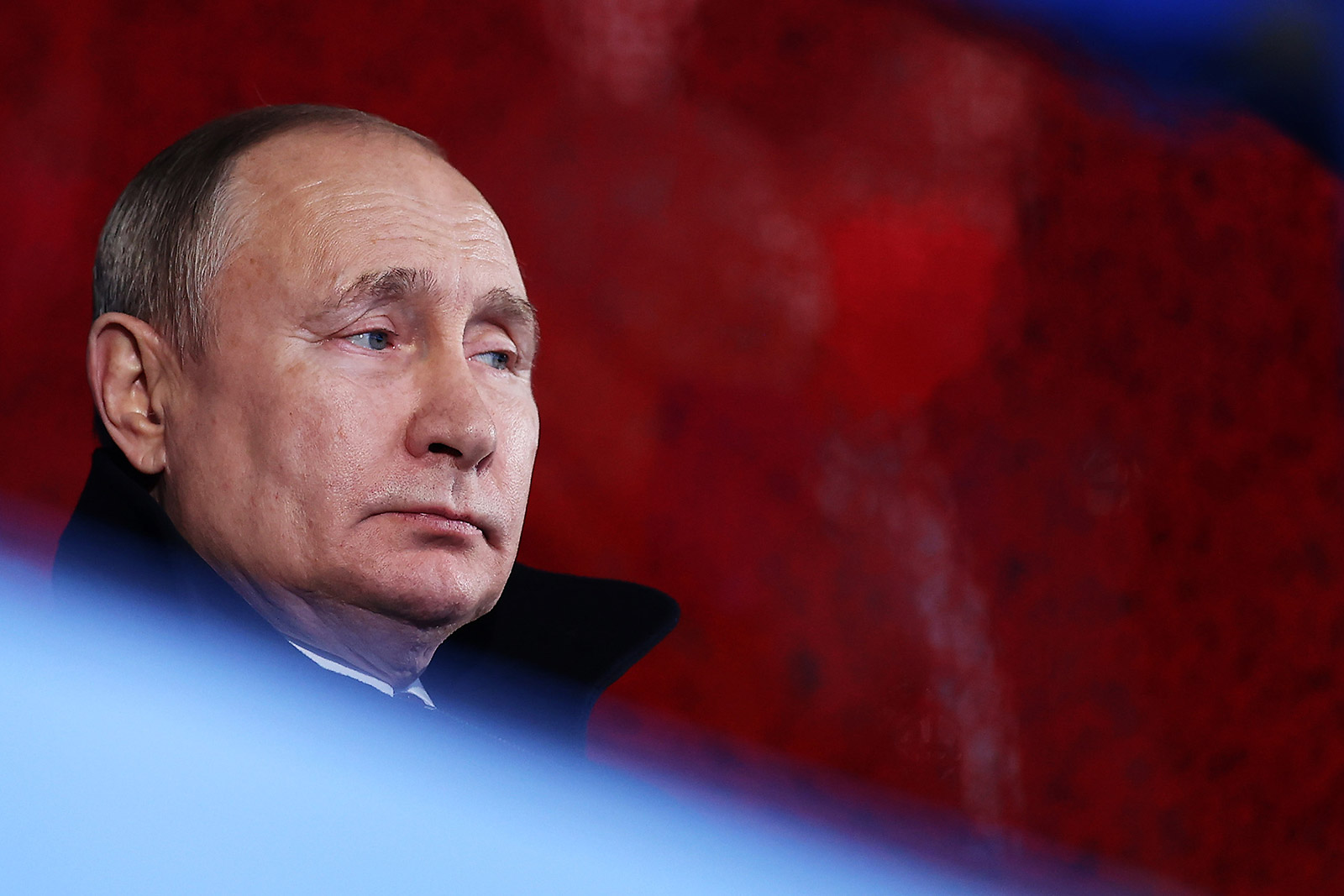 Russian President Vladimir Putin watches the Winter Olympics opening ceremony on February 4.