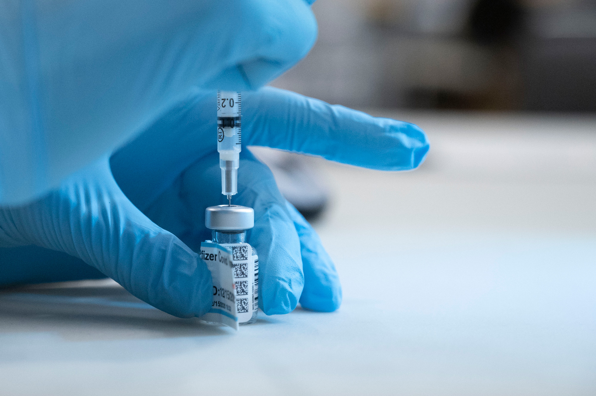 The Pfizer-BioNTech COVID-19 vaccine is prepared for injection on December 15 in Sacramento, California.