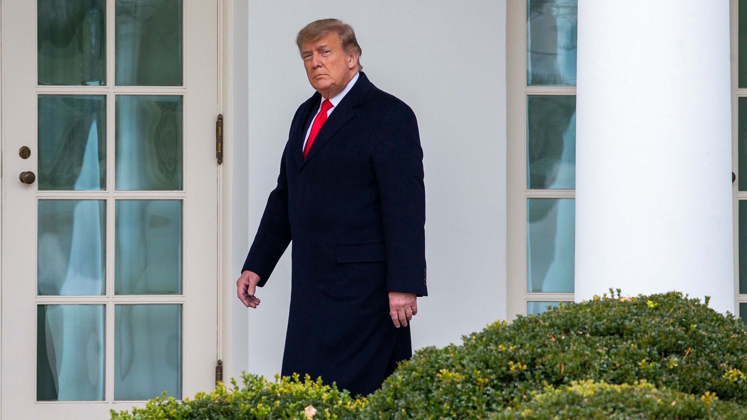 Then-President Donald Trump walks to the Oval Office in December 2020.